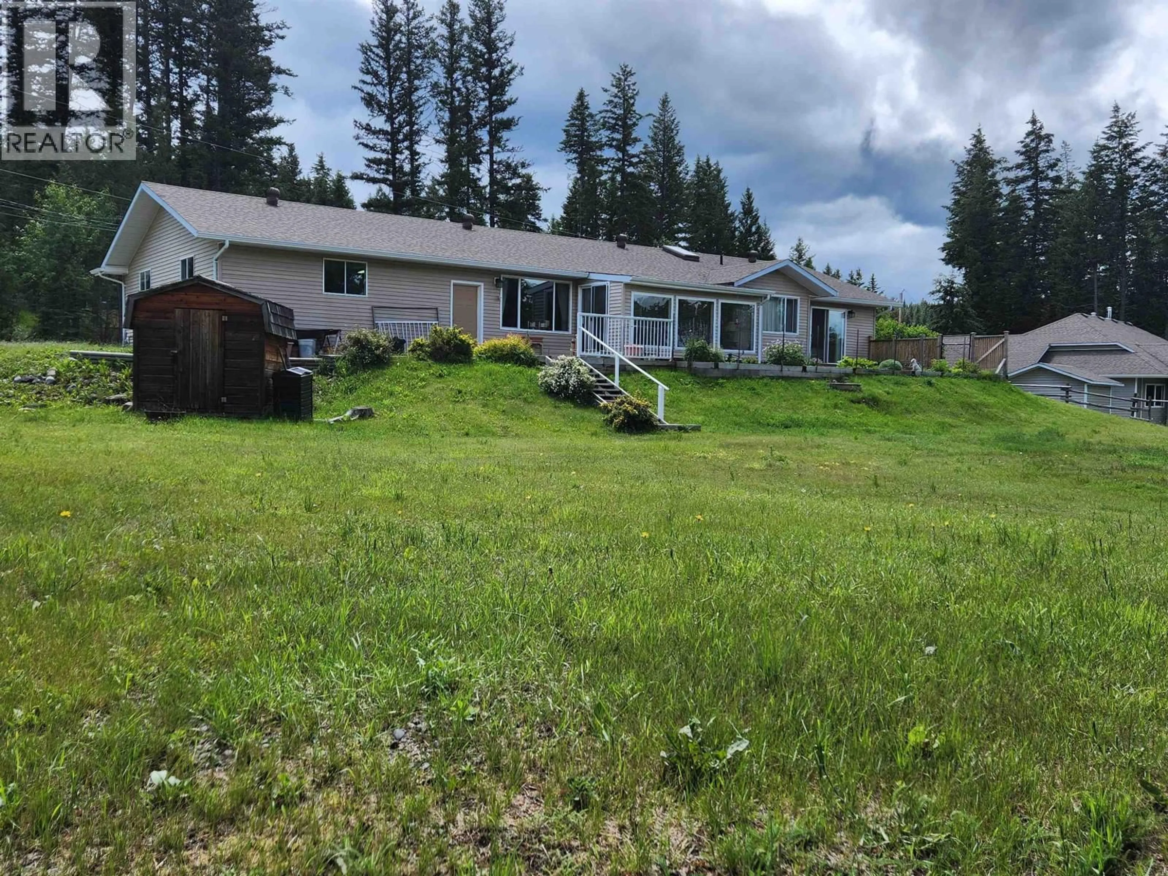 A pic from outside/outdoor area/front of a property/back of a property/a pic from drone, mountain view for 5207 KALLUM DRIVE, 108 Mile Ranch British Columbia V0K2Z0