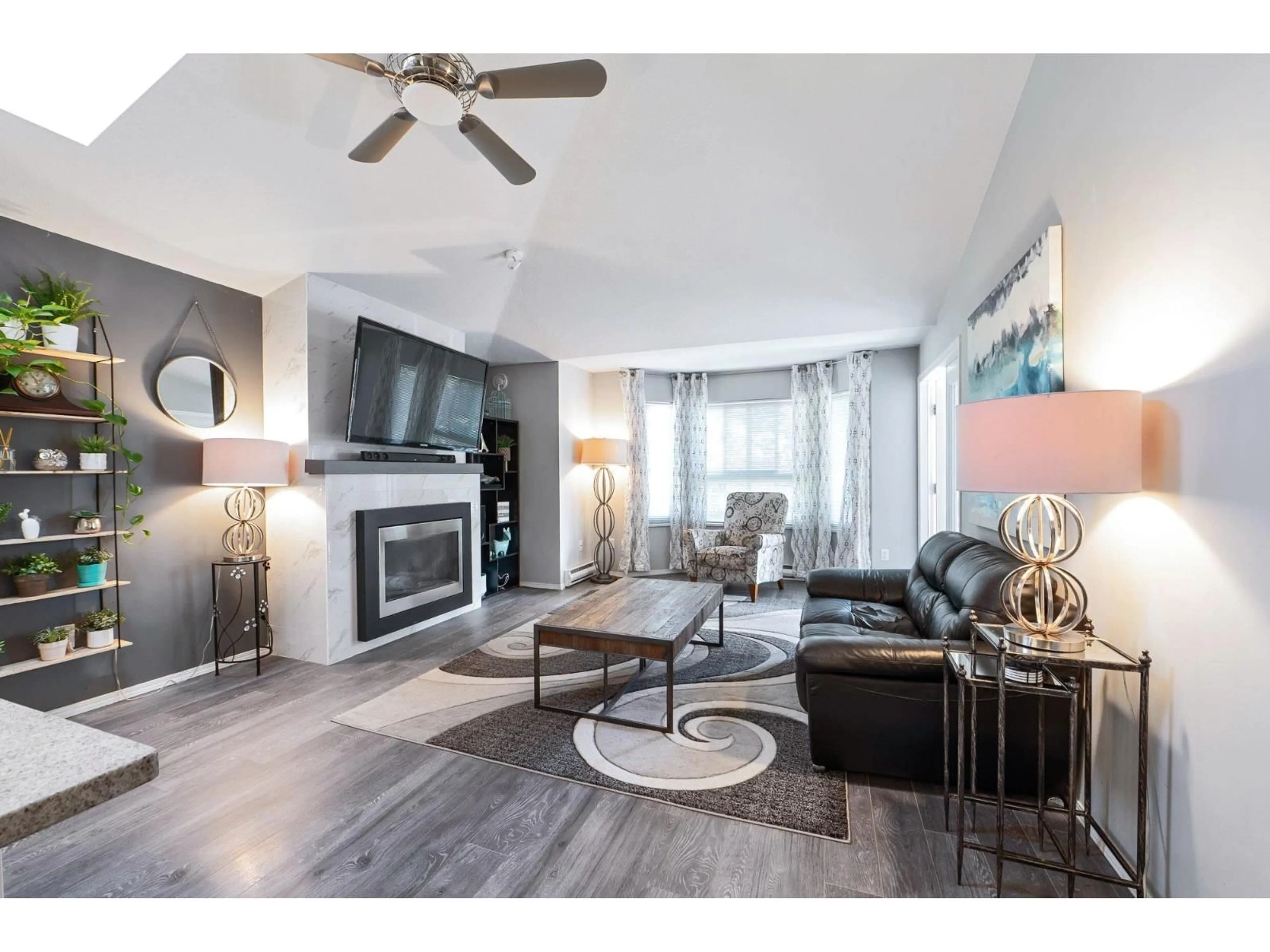 Living room with furniture, wood/laminate floor for 305 - 19721 64 AVENUE, Langley British Columbia V2Y1L1