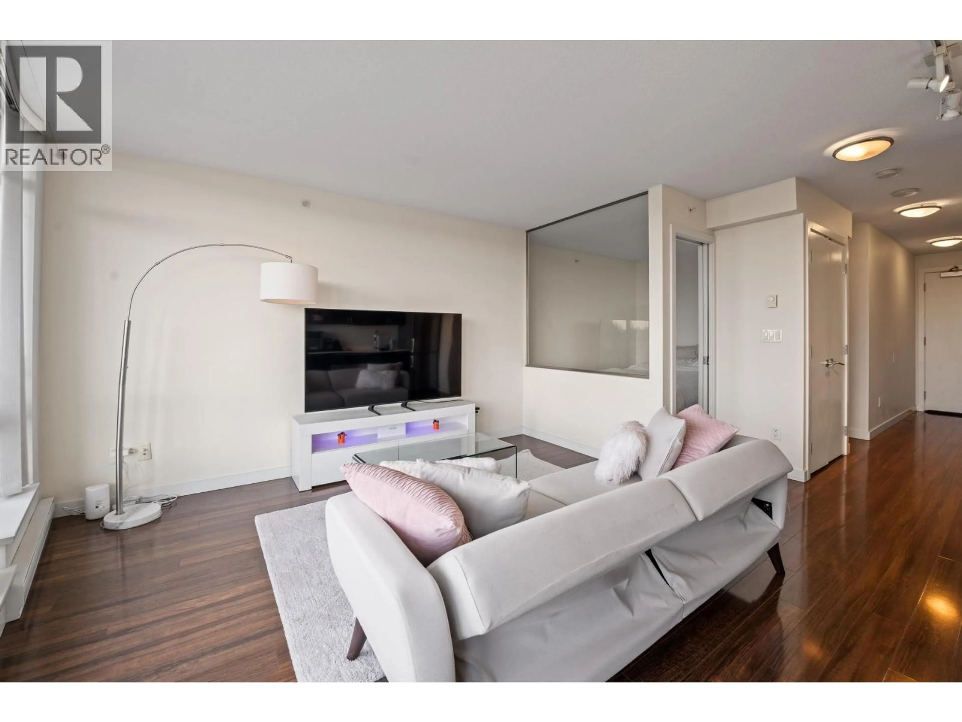 Living room with furniture, wood/laminate floor for 612 - 4888 NANAIMO STREET, Vancouver British Columbia V5N0B5