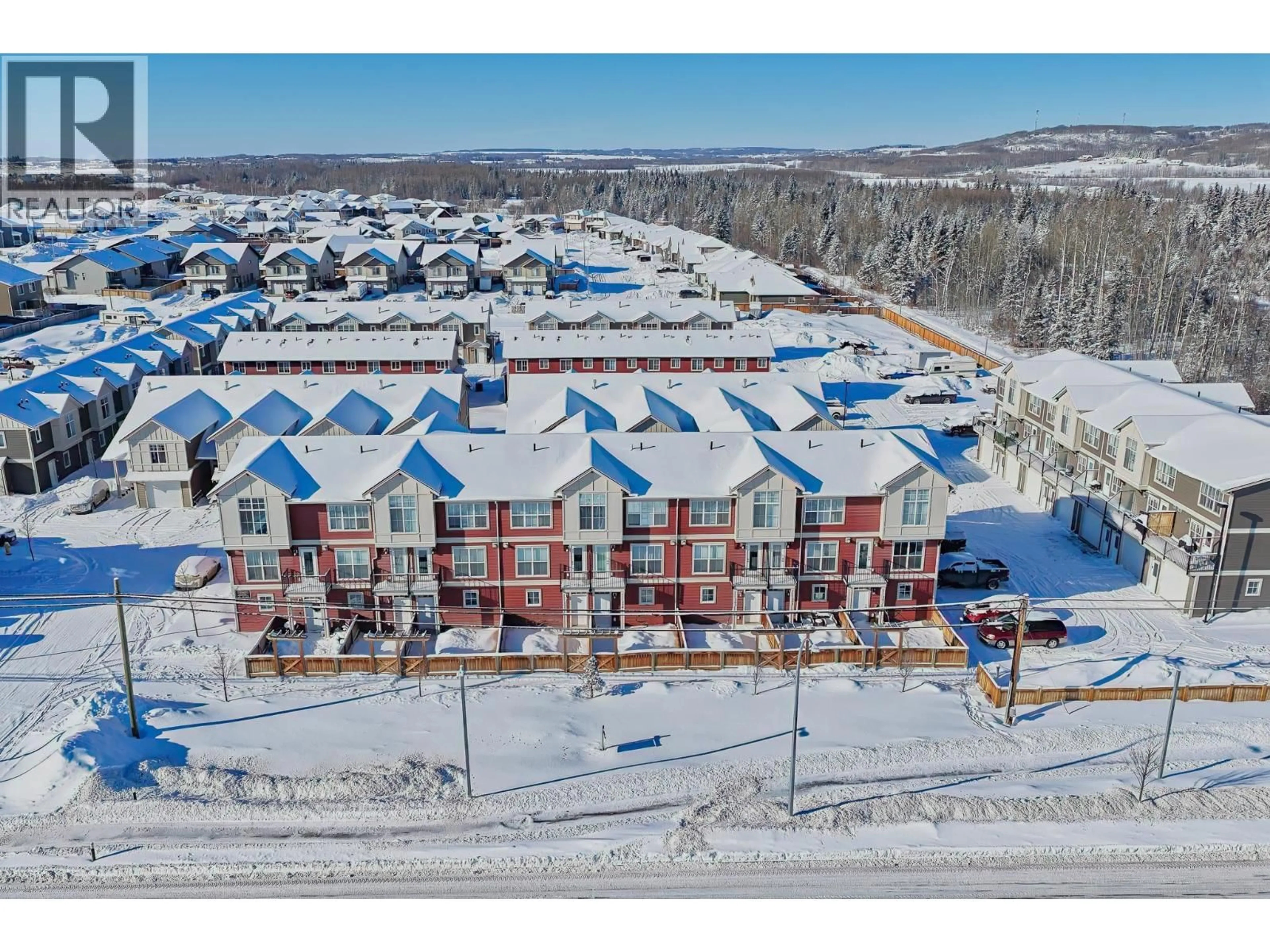 A pic from outside/outdoor area/front of a property/back of a property/a pic from drone, mountain view for 204 - 11703 102 STREET, Fort St. John British Columbia V1J0R7