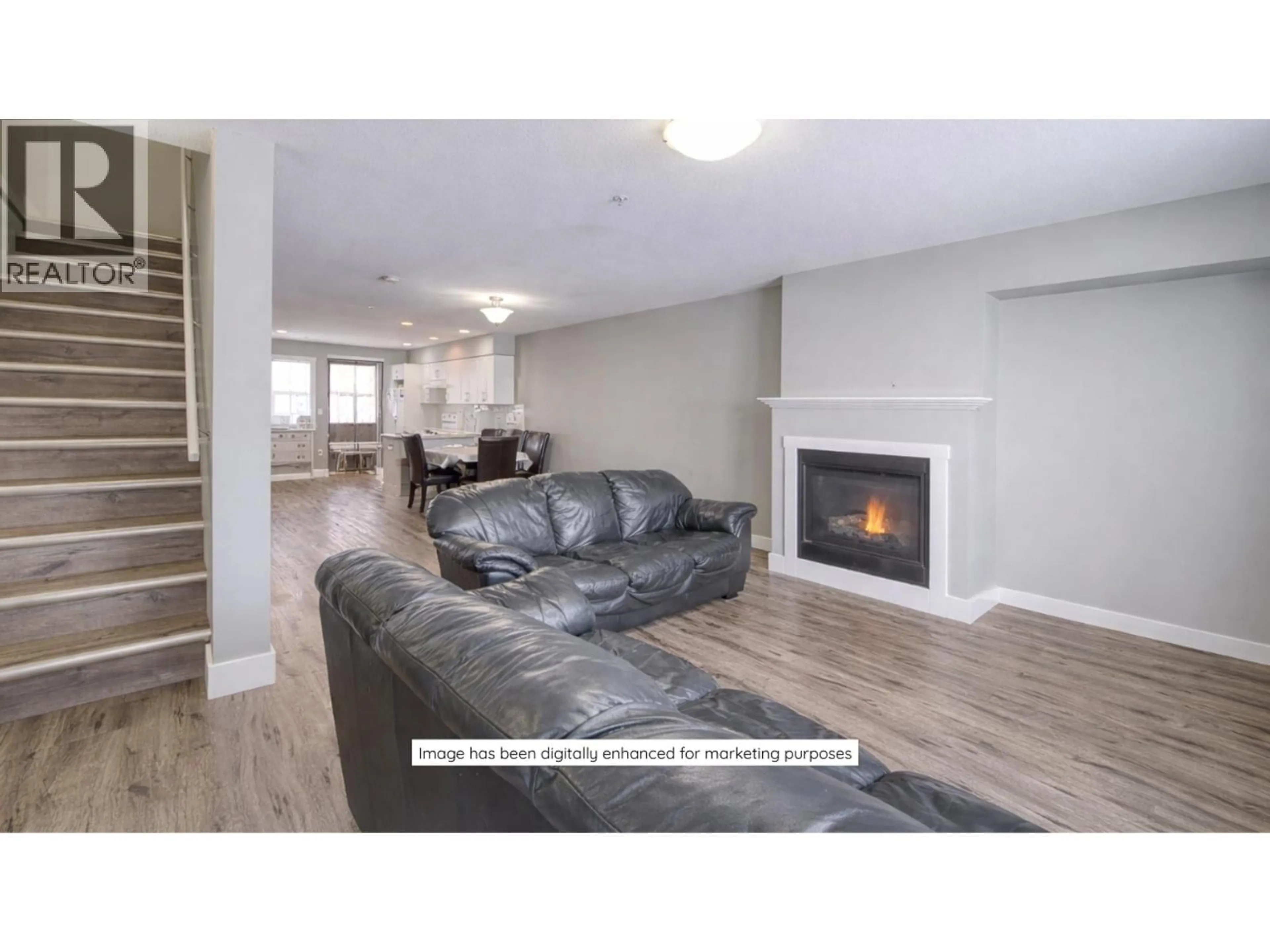 Living room with furniture, wood/laminate floor for 204 - 11703 102 STREET, Fort St. John British Columbia V1J0R7