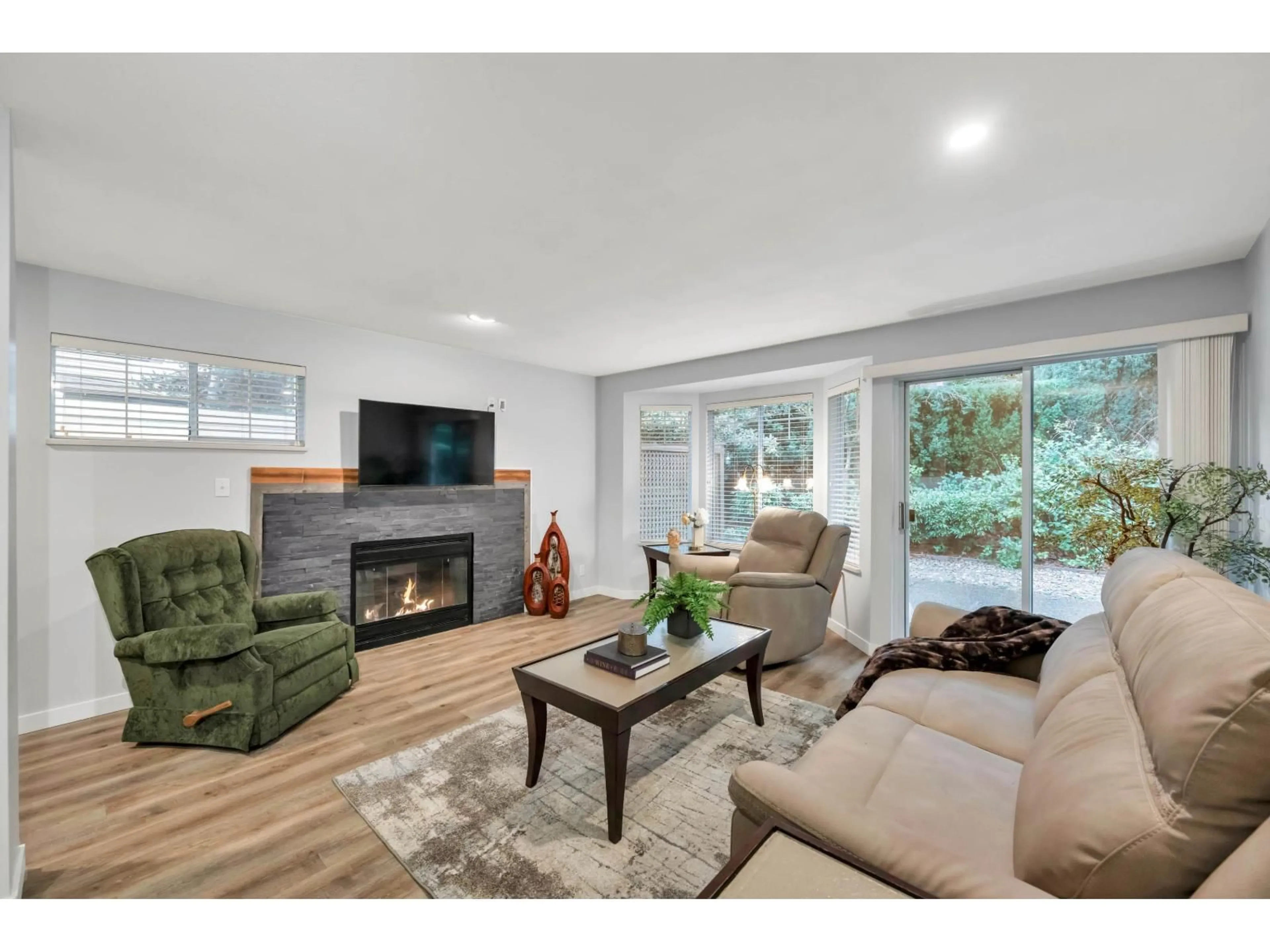 Living room with furniture, wood/laminate floor for 159 - 20391 96 AVENUE, Langley British Columbia V1M2L2