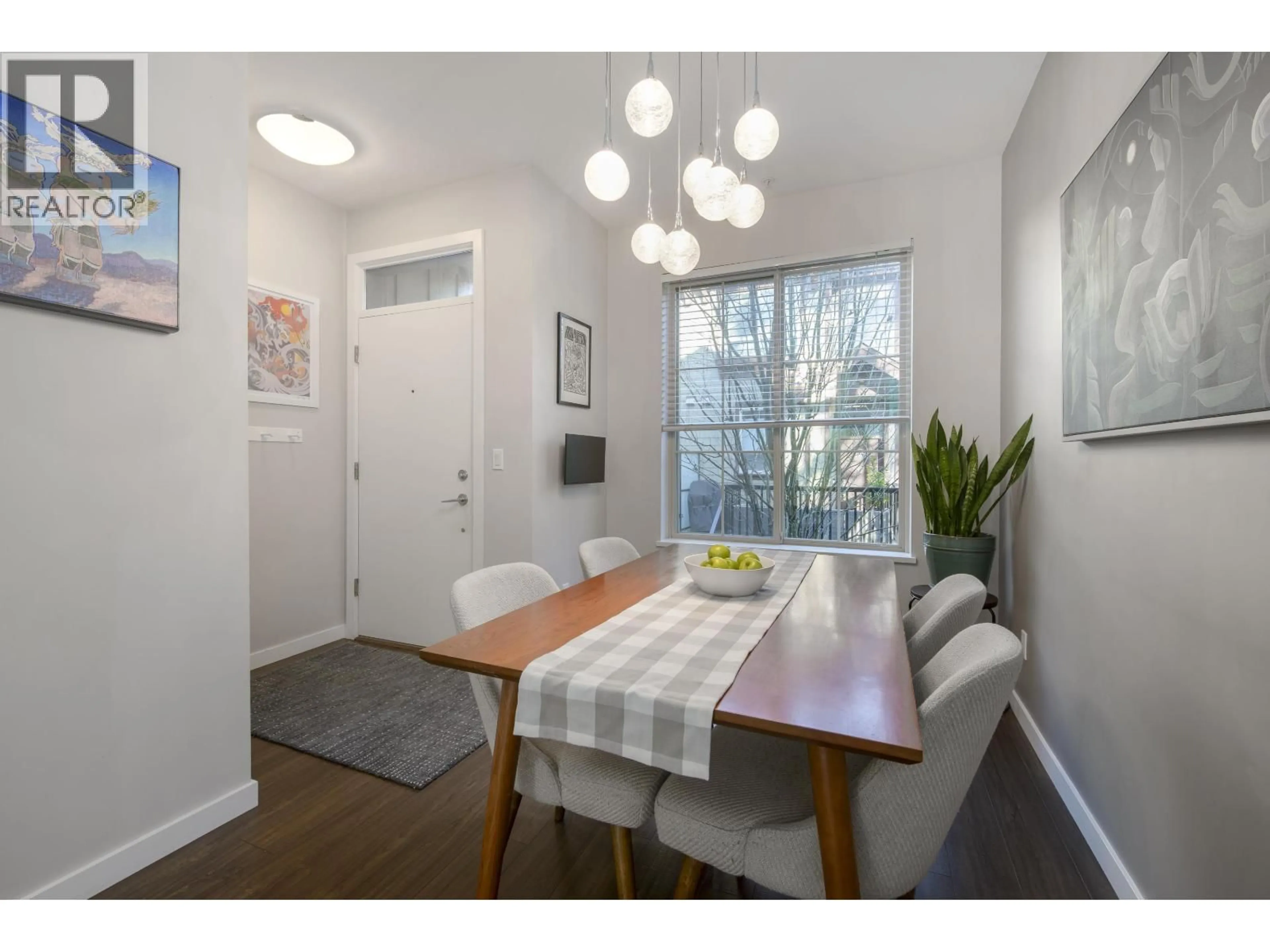 Dining room, wood/laminate floor for 33 - 433 SEYMOUR RIVER PLACE, North Vancouver British Columbia V7H0B8