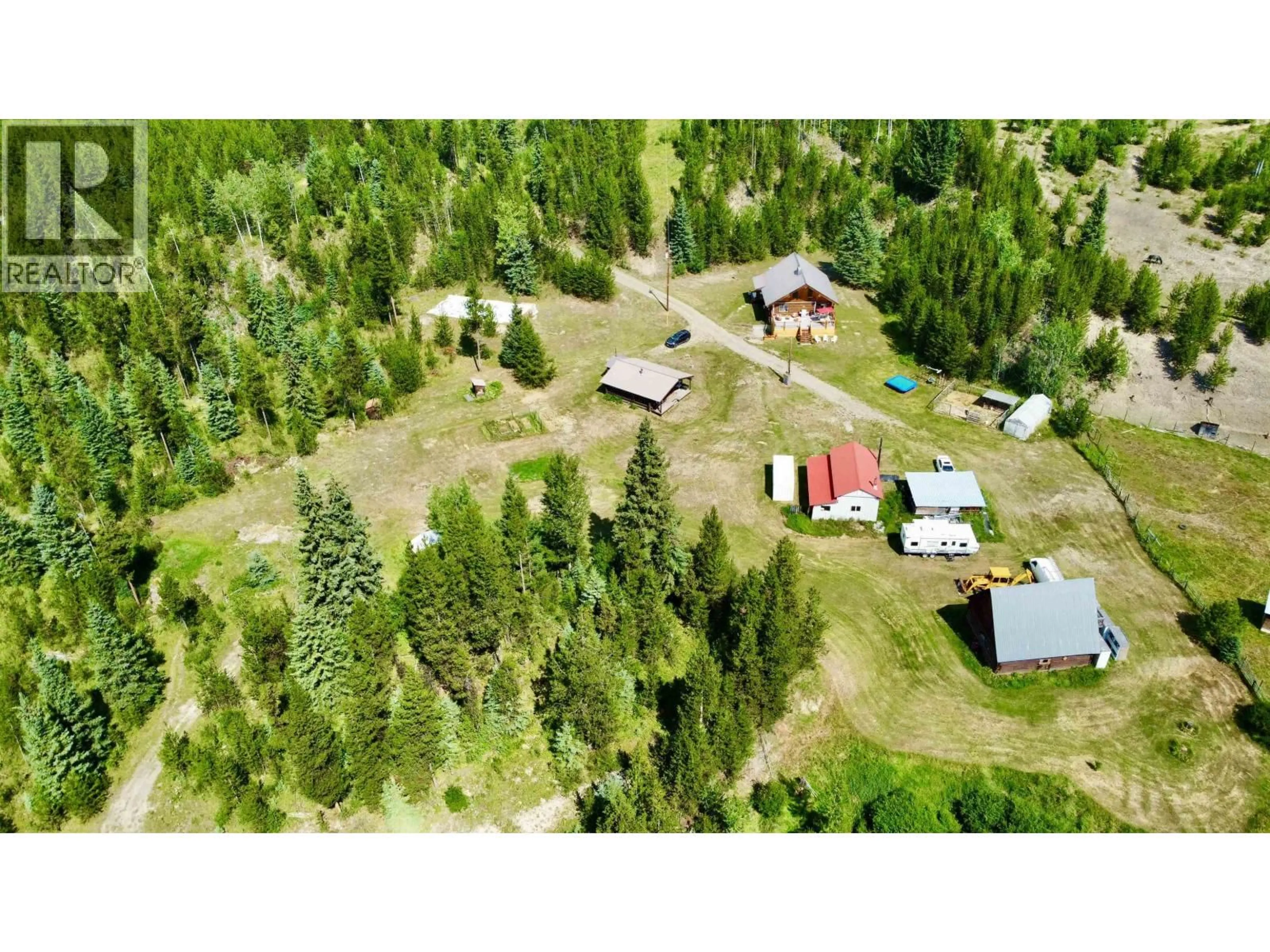 A pic from outside/outdoor area/front of a property/back of a property/a pic from drone, forest/trees view for 6784 JUDSON ROAD, Bridge Lake British Columbia V0K1X3