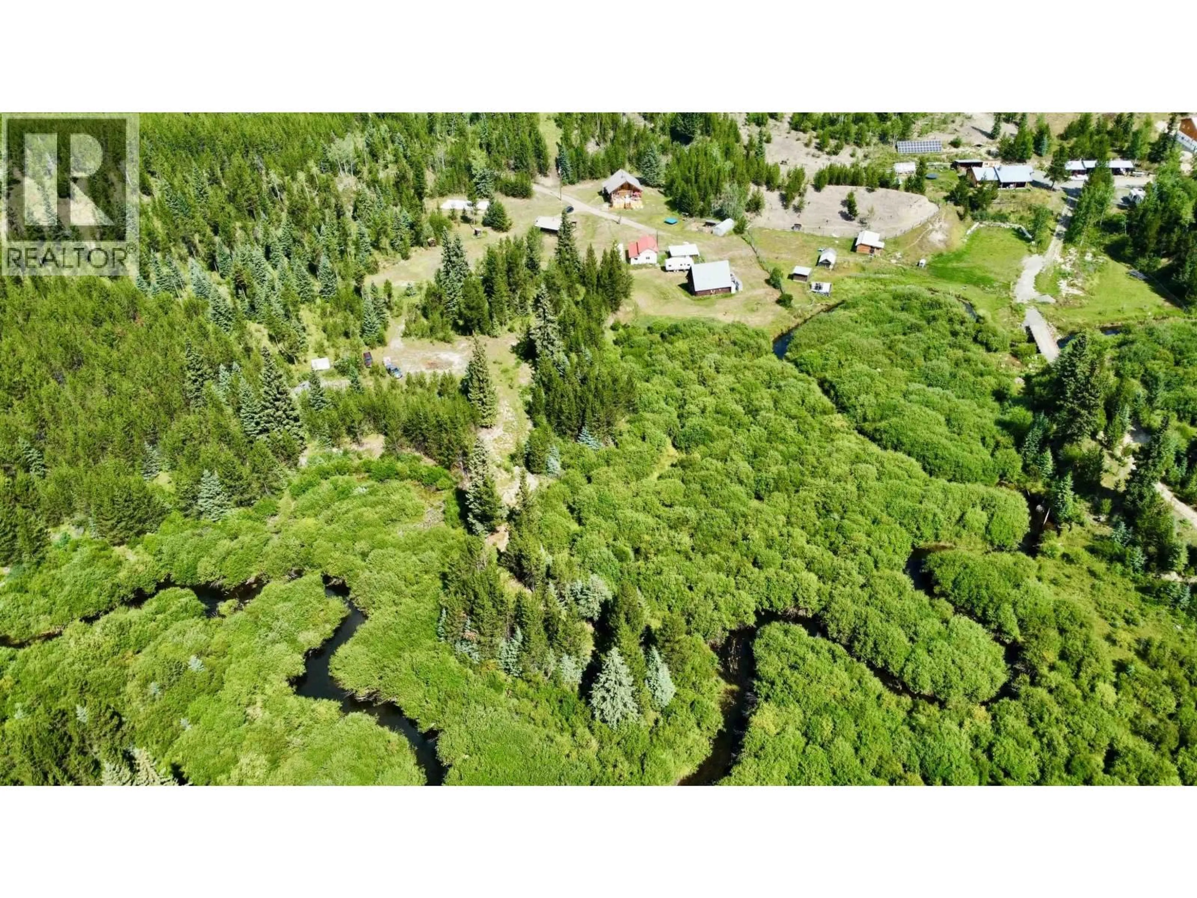 A pic from outside/outdoor area/front of a property/back of a property/a pic from drone, forest/trees view for 6784 JUDSON ROAD, Bridge Lake British Columbia V0K1X3