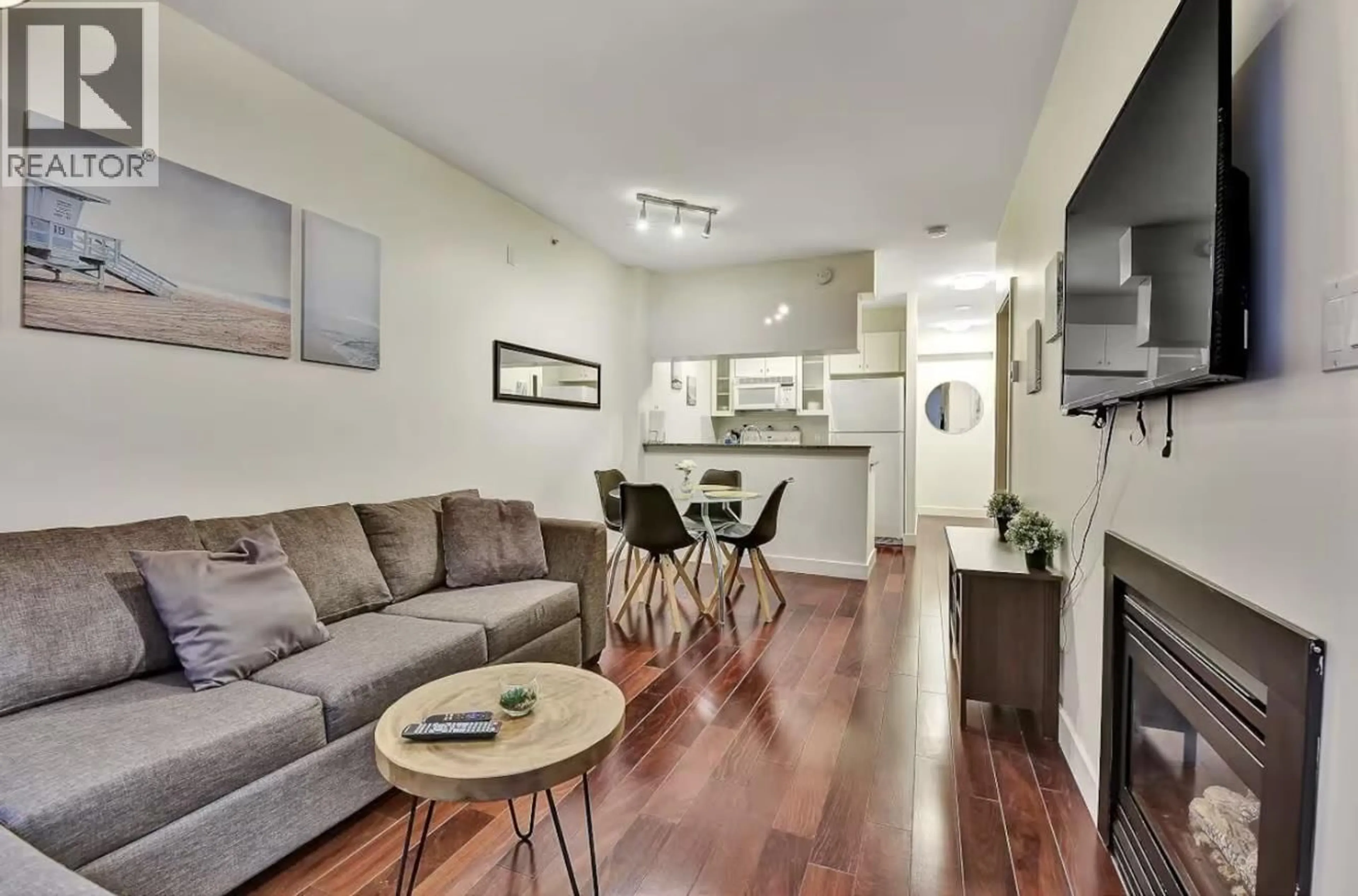 Living room with furniture, wood/laminate floor for 401 - 1238 BURRARD STREET, Vancouver British Columbia V6Z3E1