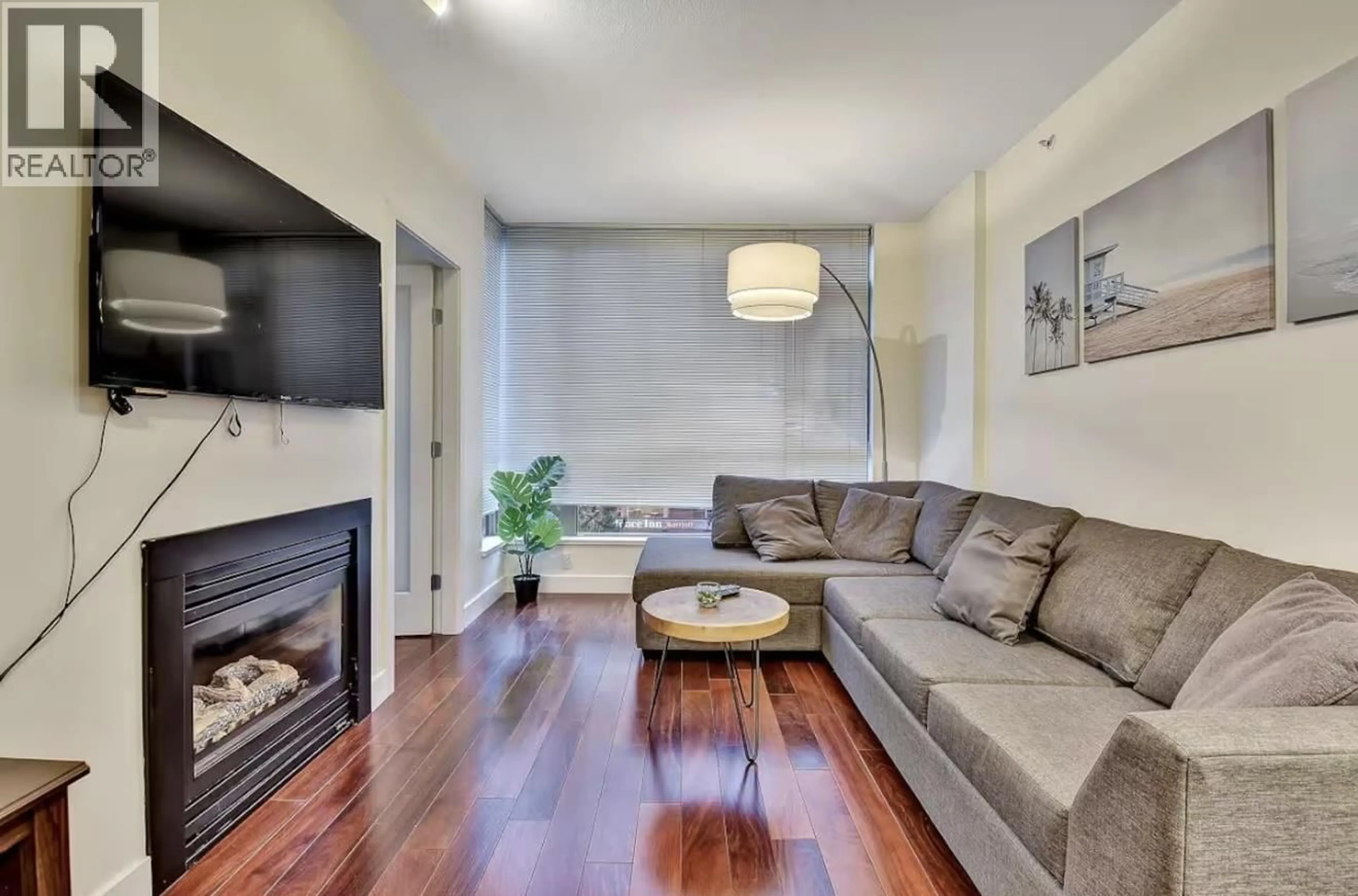 Living room with furniture, wood/laminate floor for 401 - 1238 BURRARD STREET, Vancouver British Columbia V6Z3E1