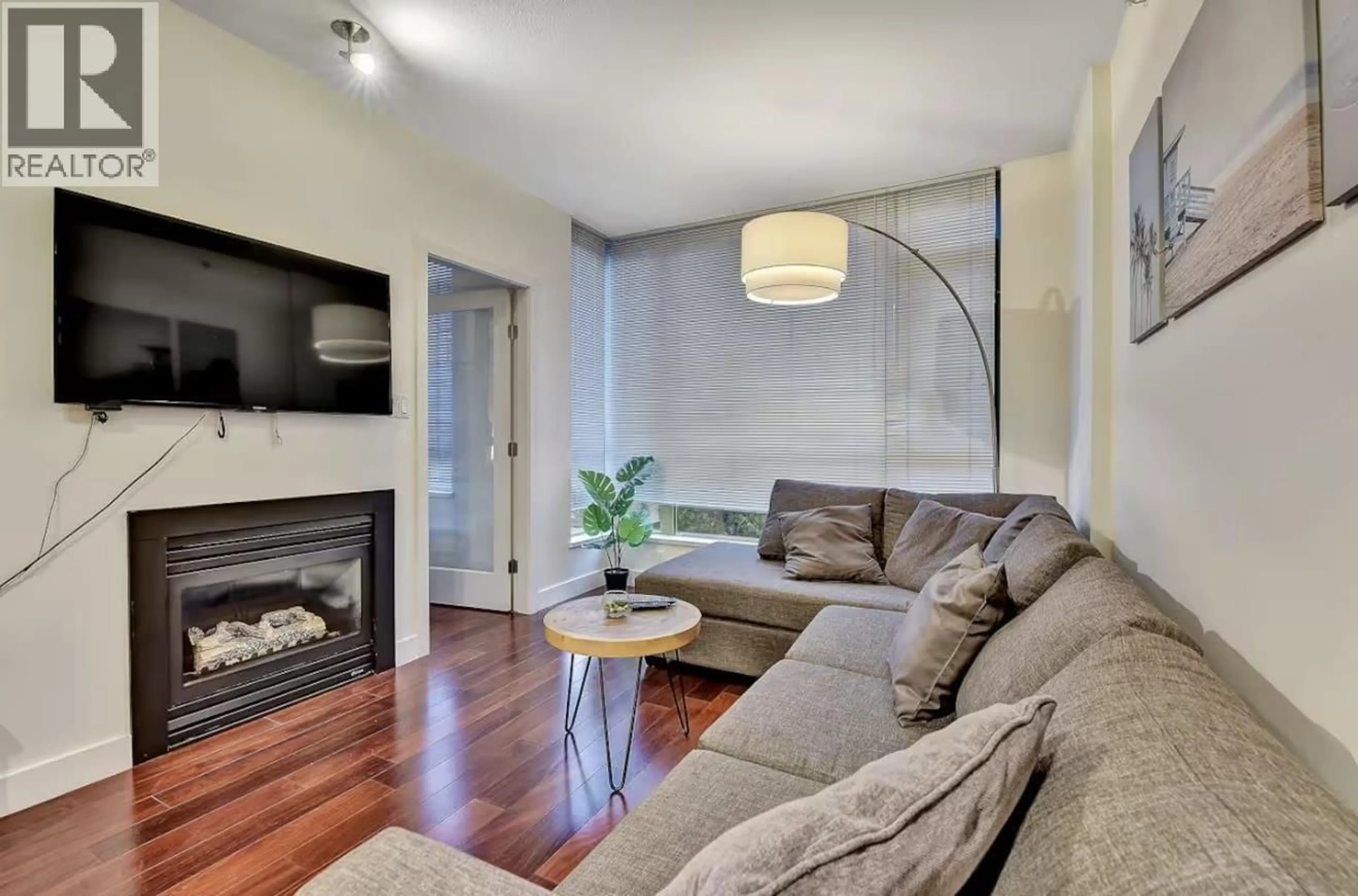 Living room with furniture, wood/laminate floor for 401 - 1238 BURRARD STREET, Vancouver British Columbia V6Z3E1