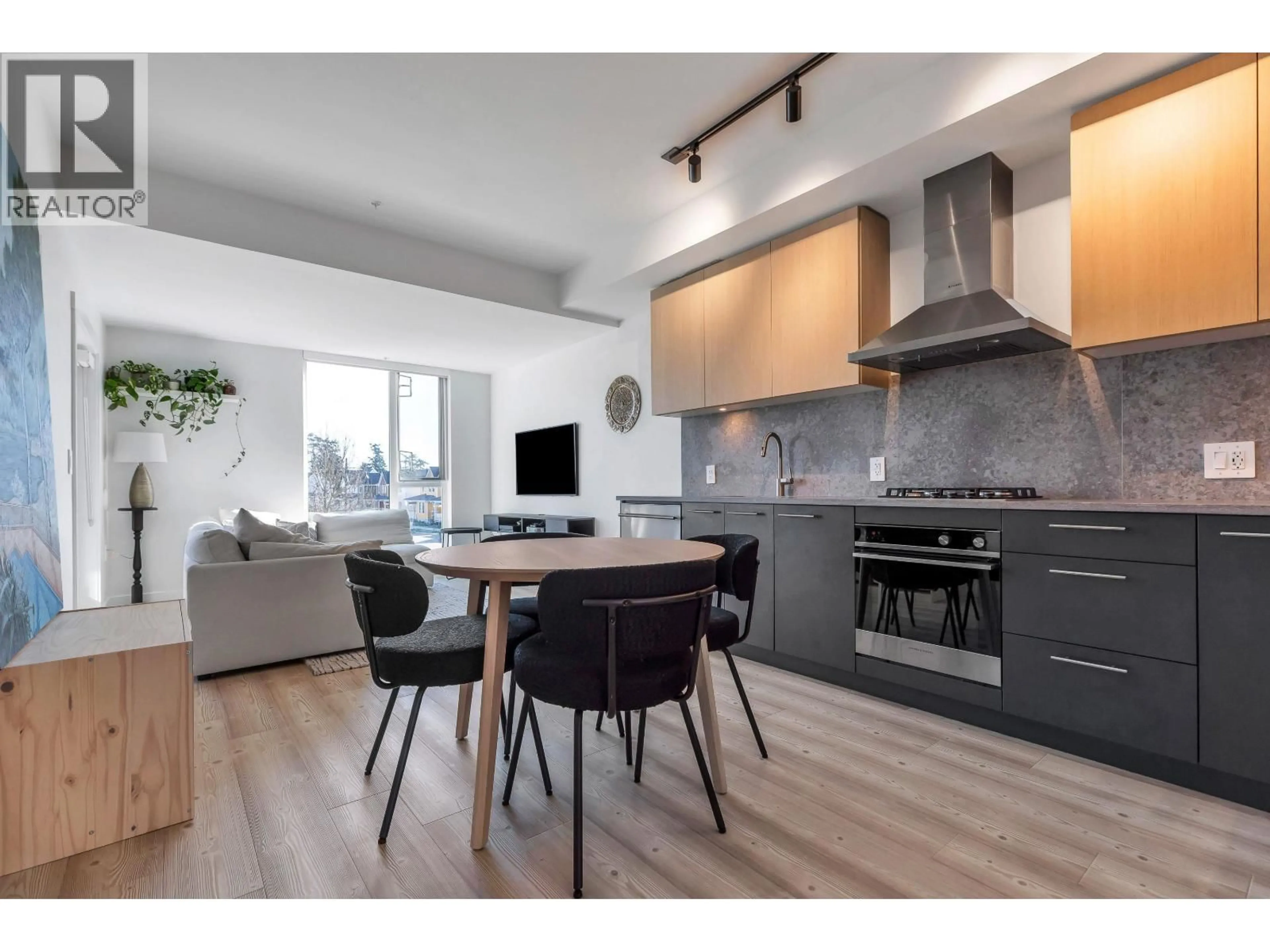 Open concept kitchen, wood/laminate floor for 201 - 251 BOUNDARY BAY ROAD, Delta British Columbia V4L0B6