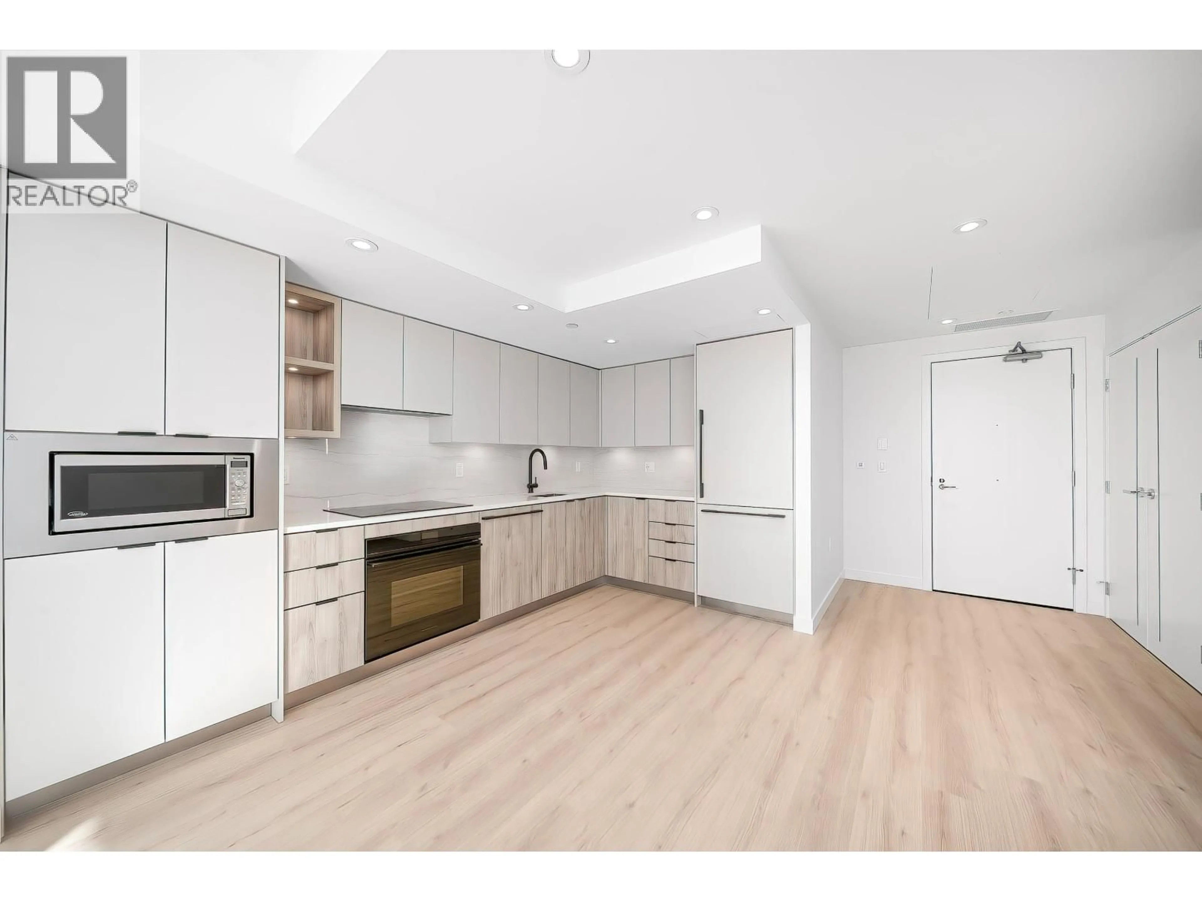 Open concept kitchen, wood/laminate floor for 619 - 755 HARBOURSIDE DRIVE, Vancouver British Columbia V7P0G1