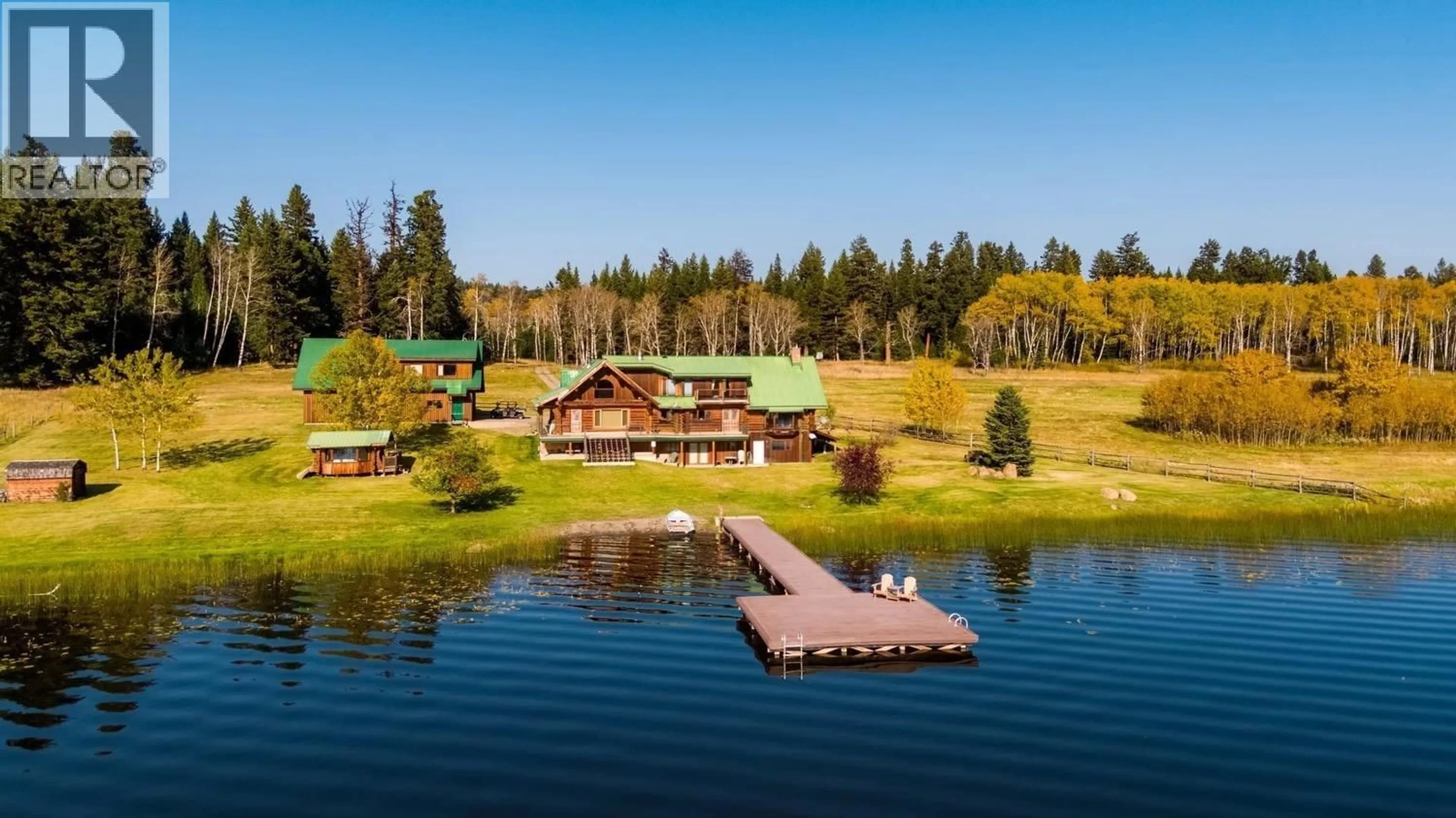 A pic from outside/outdoor area/front of a property/back of a property/a pic from drone, water/lake/river/ocean view for 5810 SIMON LAKE ROAD, 108 Mile Ranch British Columbia V0K2E3
