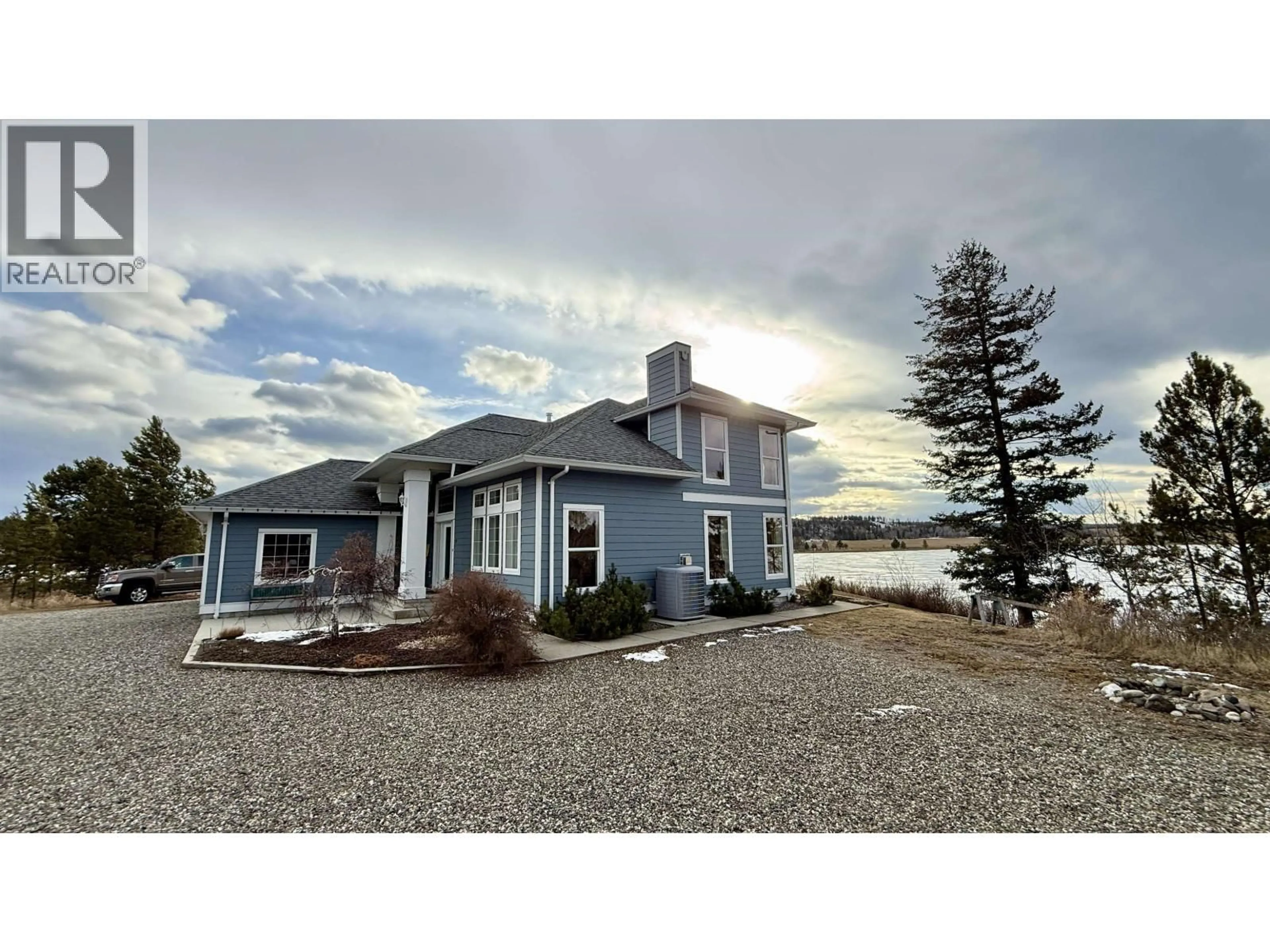 A pic from outside/outdoor area/front of a property/back of a property/a pic from drone, water/lake/river/ocean view for 5456 CARLSON ROAD, 108 Mile Ranch British Columbia V0K2E1