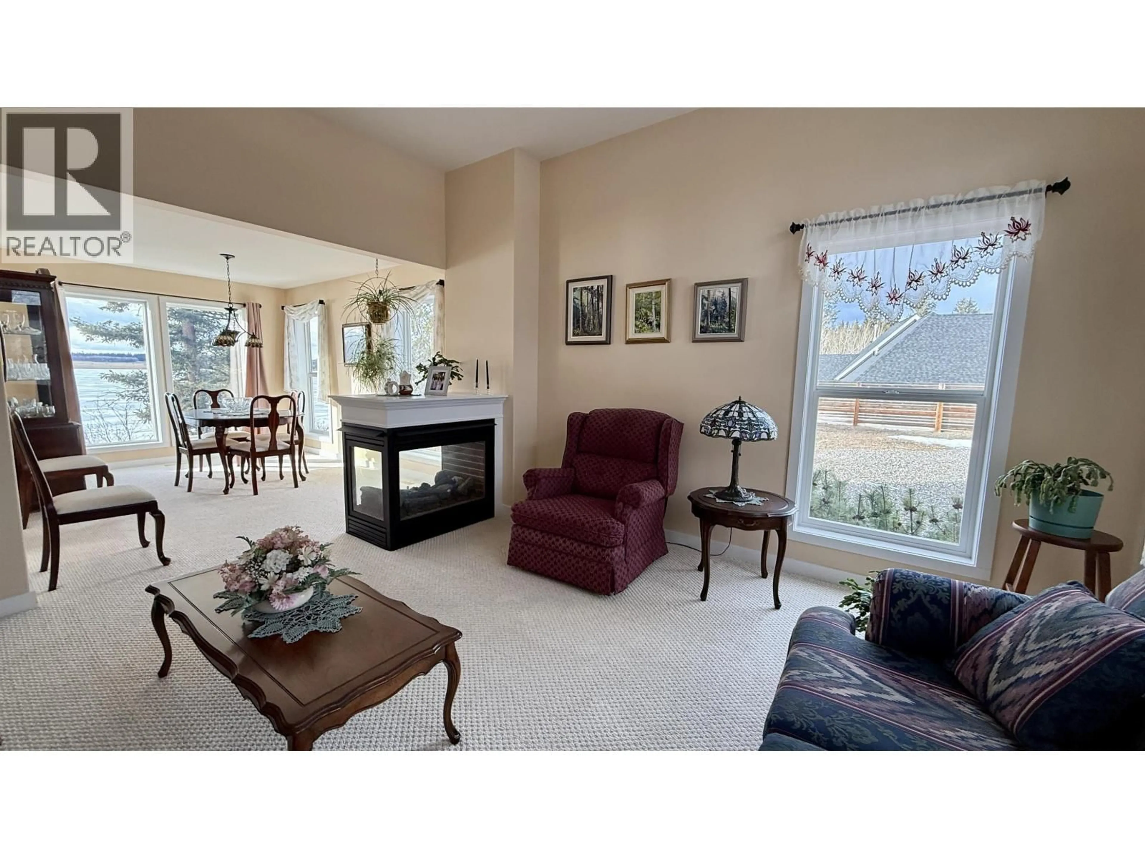 Living room with furniture, ceramic/tile floor for 5456 CARLSON ROAD, 108 Mile Ranch British Columbia V0K2E1
