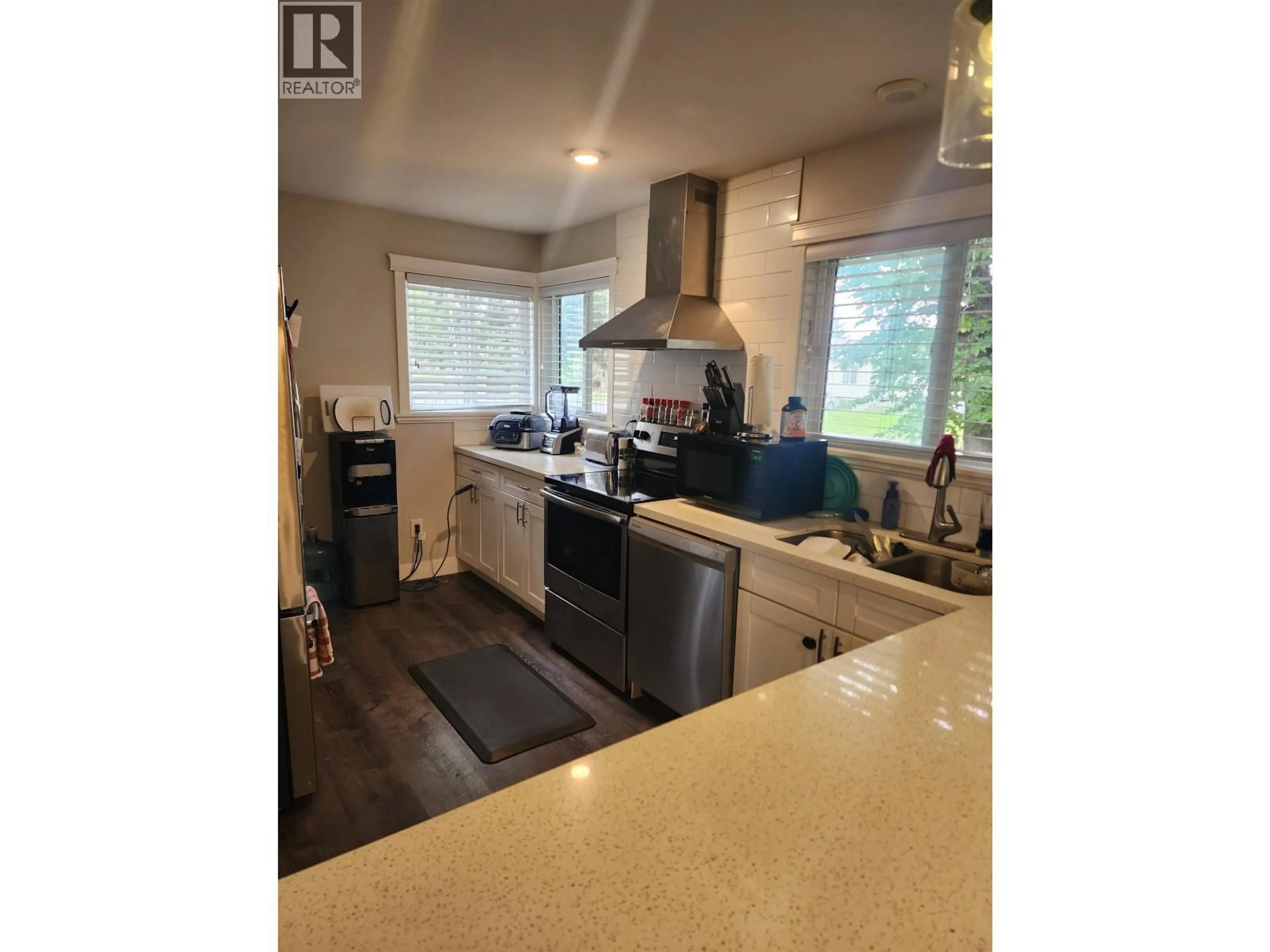 Open concept kitchen, wood/laminate floor for 1933 UPLAND STREET, Prince George British Columbia V2L2V5