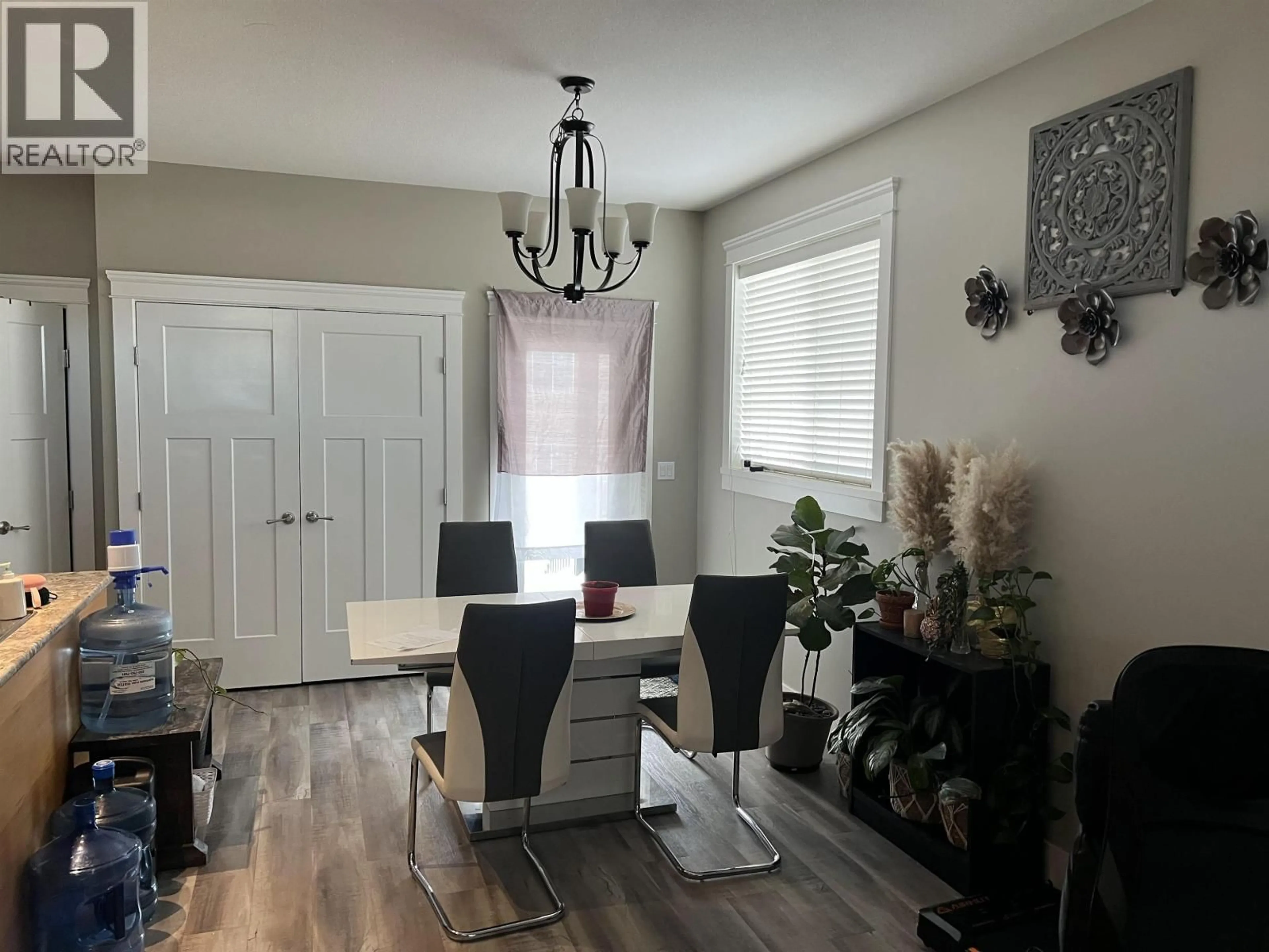 Dining room, wood/laminate floor for 8215 88 AVENUE, Fort St. John British Columbia V1J0N9