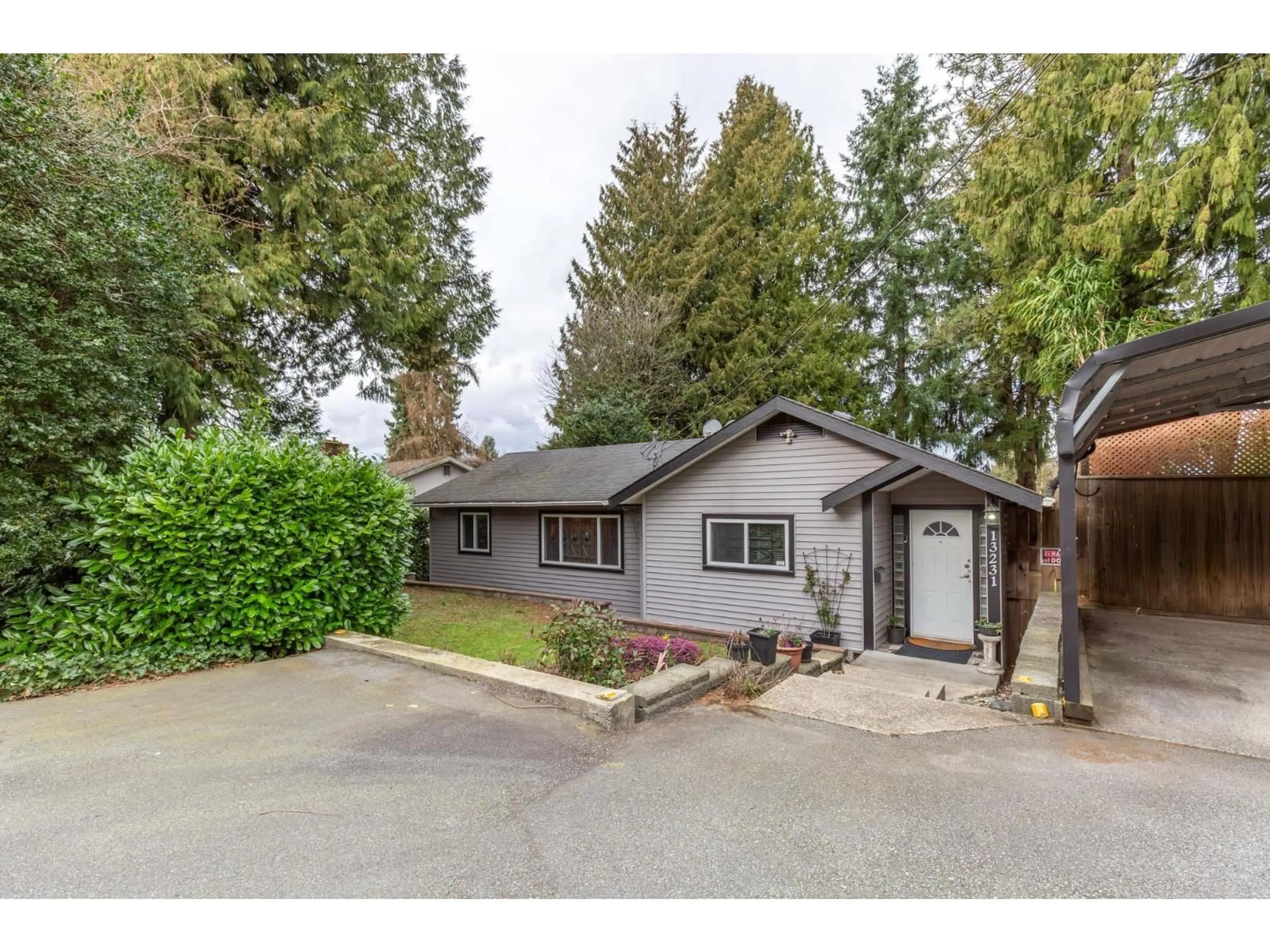 Home with vinyl exterior material, street for 13231 112B AVENUE, Surrey British Columbia V3R2H4