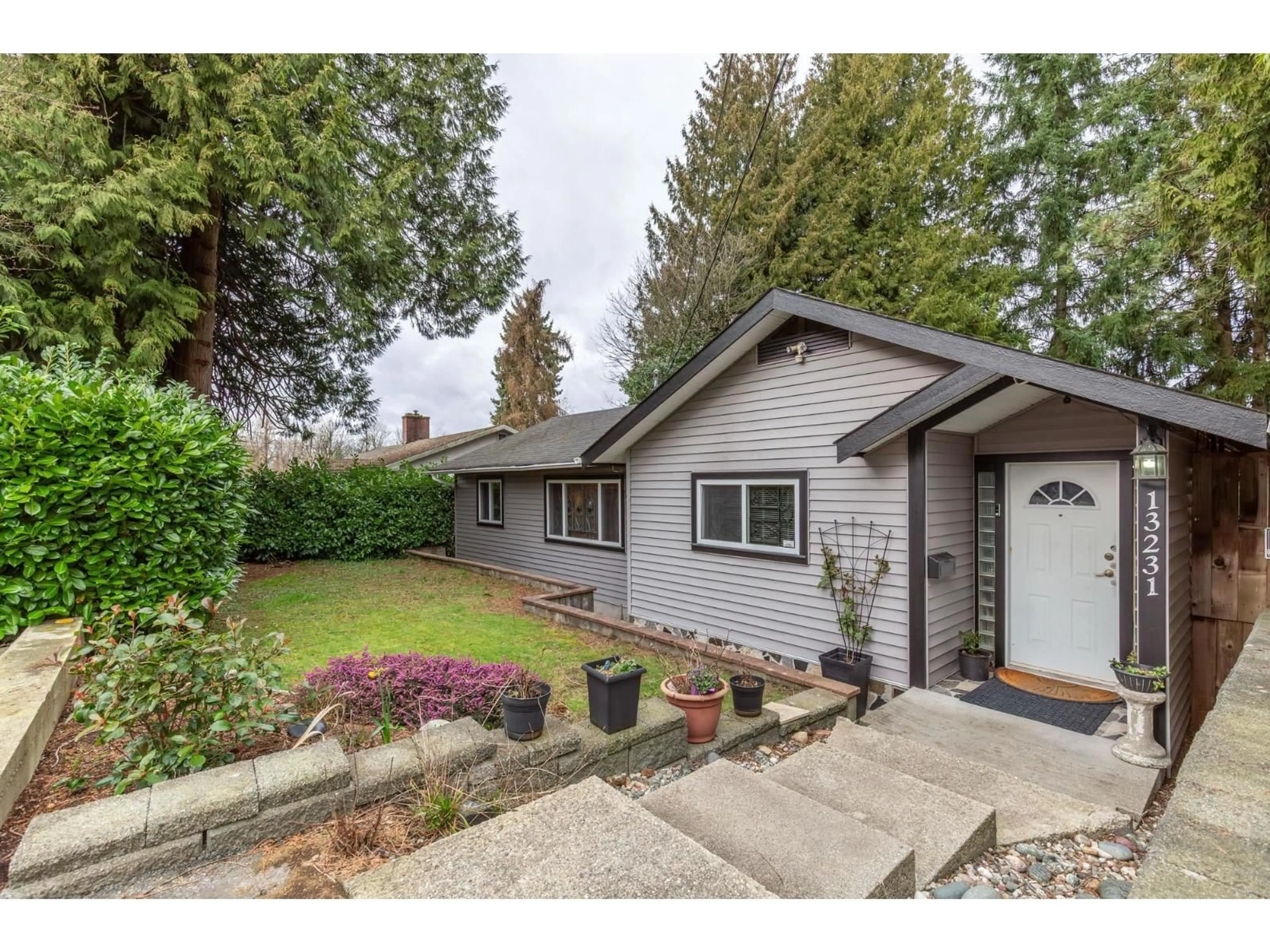 Home with vinyl exterior material, street for 13231 112B AVENUE, Surrey British Columbia V3R2H4