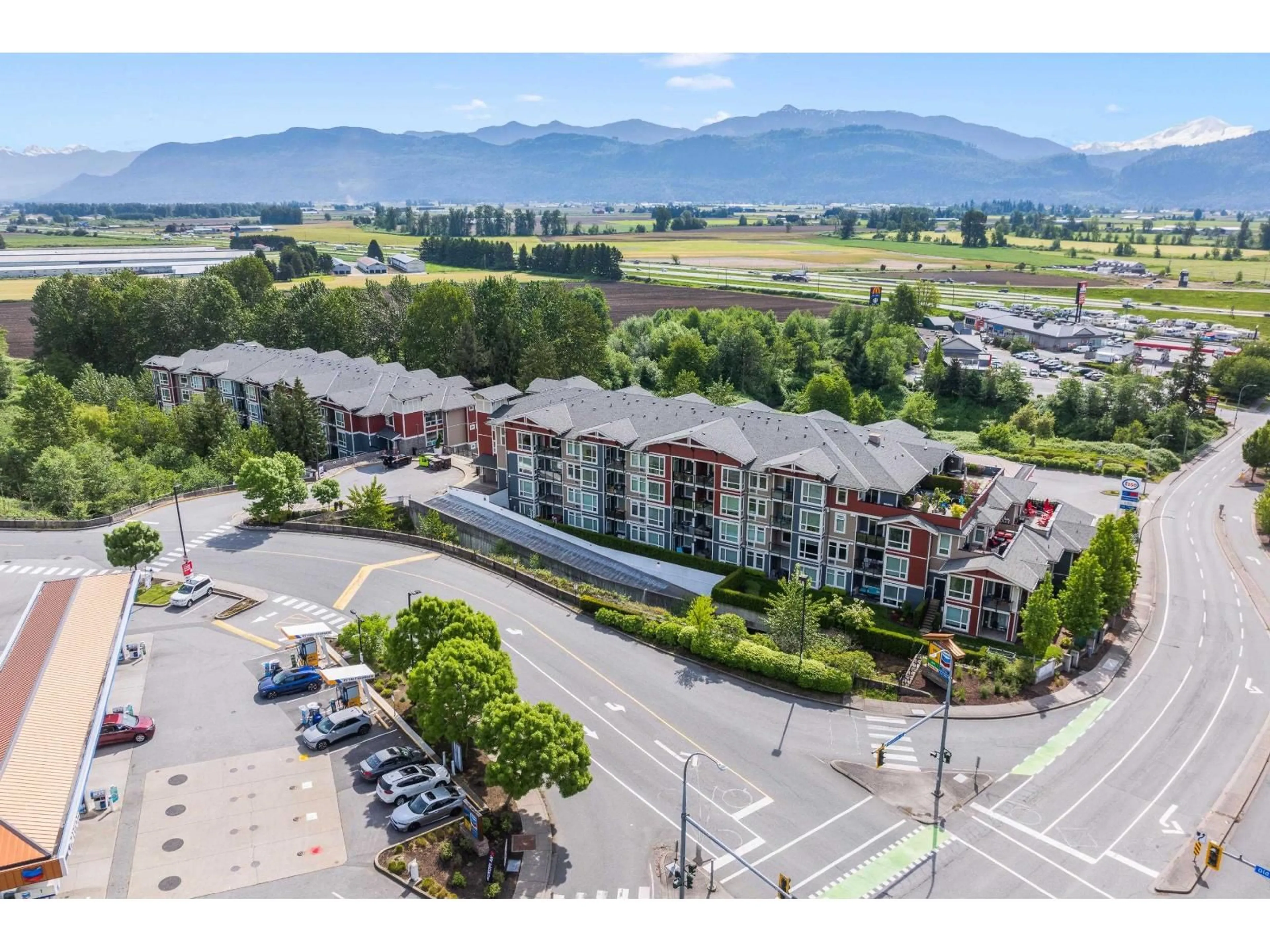 A pic from outside/outdoor area/front of a property/back of a property/a pic from drone, mountain view for 404 - 2238 WHATCOM ROAD, Abbotsford British Columbia V3G0E6