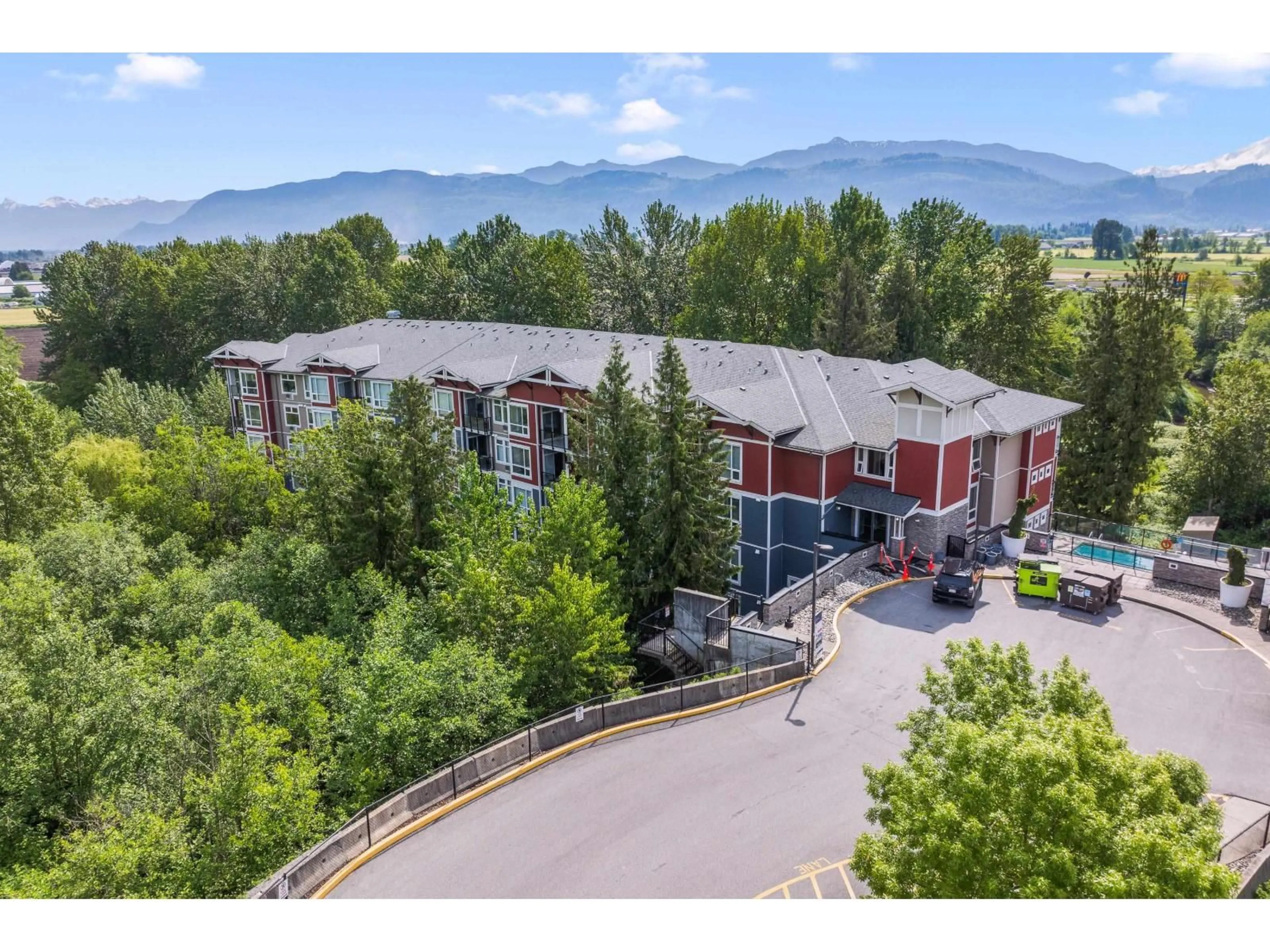 A pic from outside/outdoor area/front of a property/back of a property/a pic from drone, mountain view for 404 - 2238 WHATCOM ROAD, Abbotsford British Columbia V3G0E6