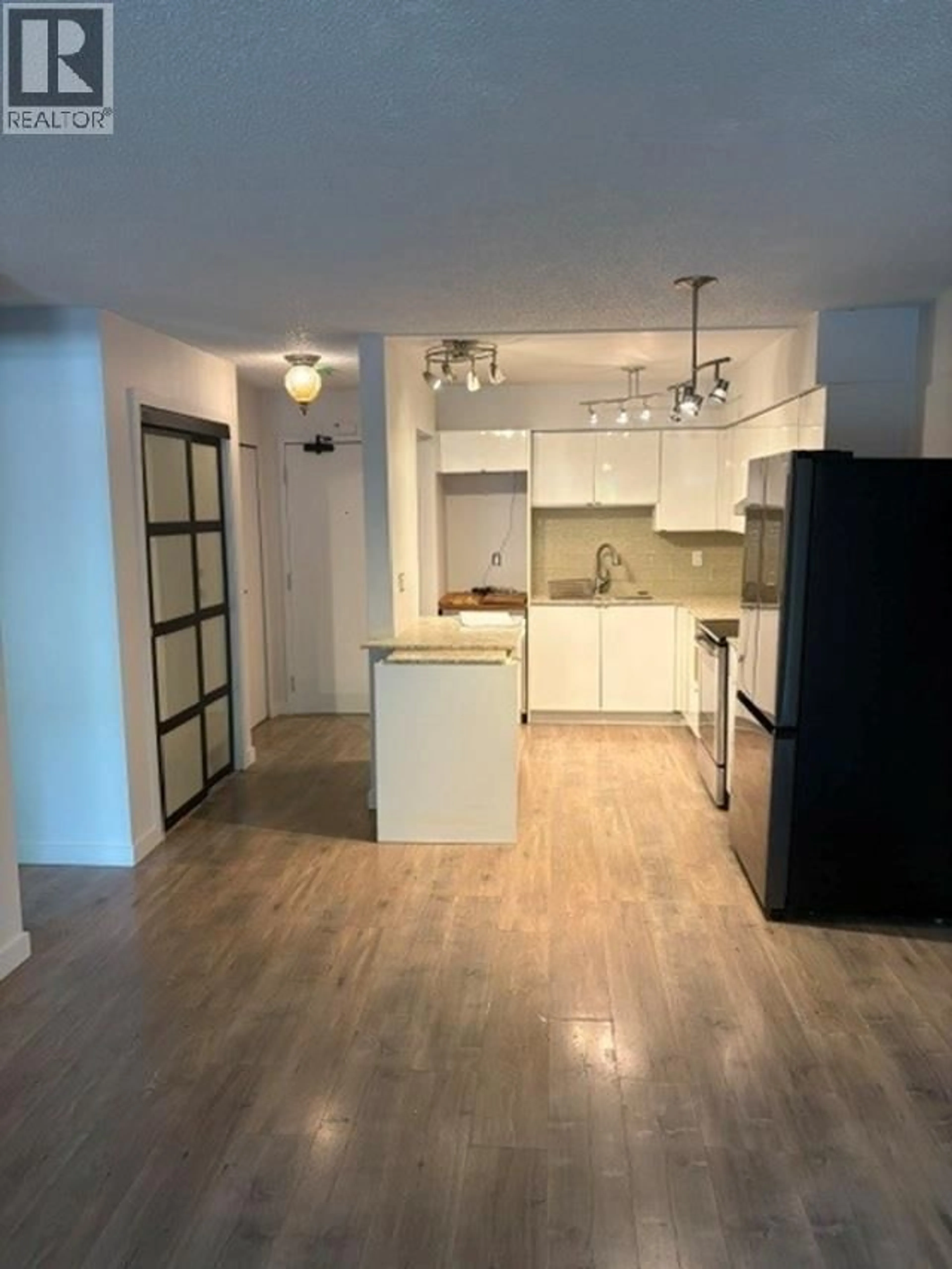 Open concept kitchen, wood/laminate floor for 205 - 2328 OXFORD STREET, Vancouver British Columbia V5L1G3