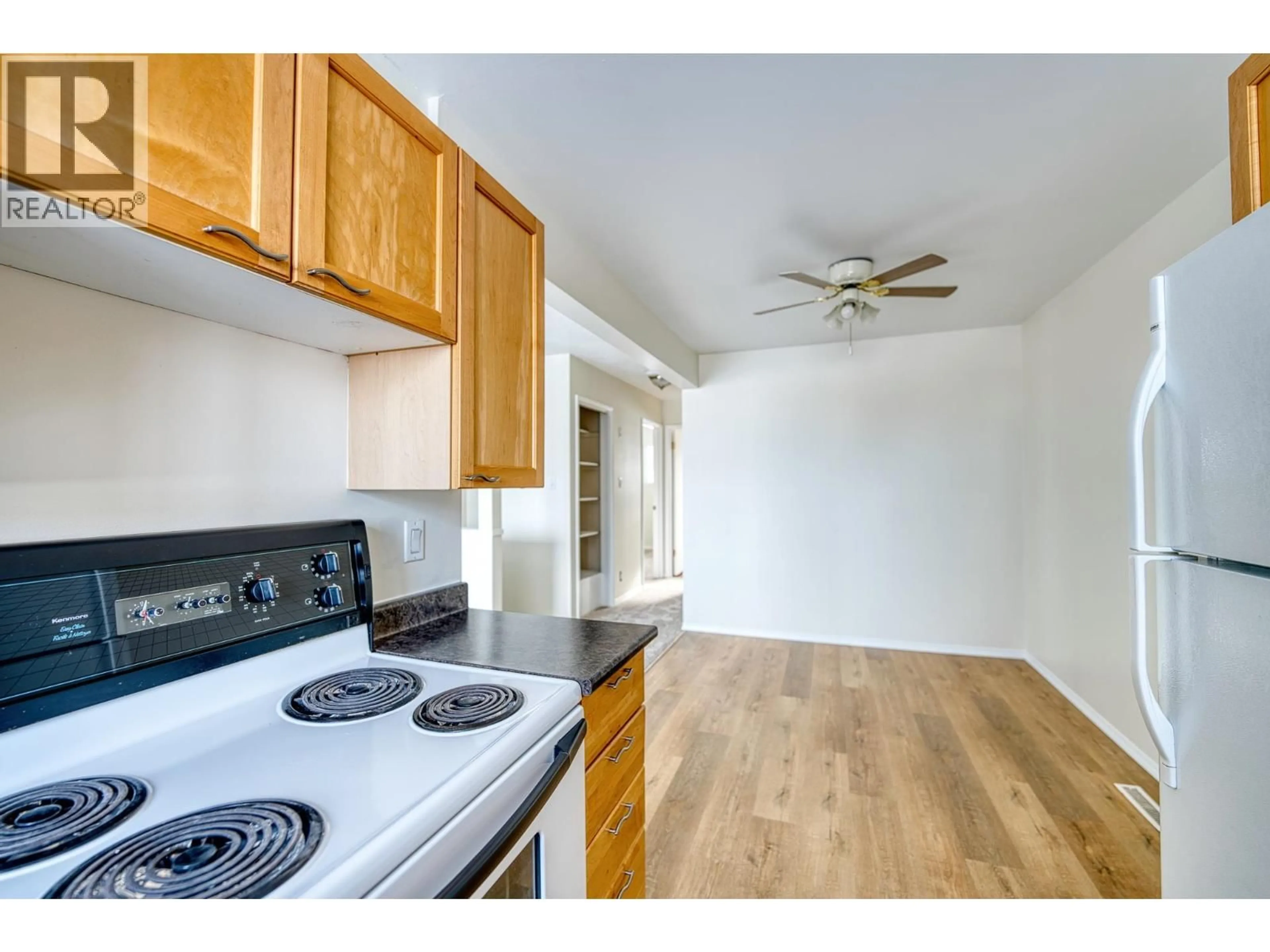 Standard kitchen, wood/laminate floor for 9021 102 AVENUE, Fort St. John British Columbia V1J2G4