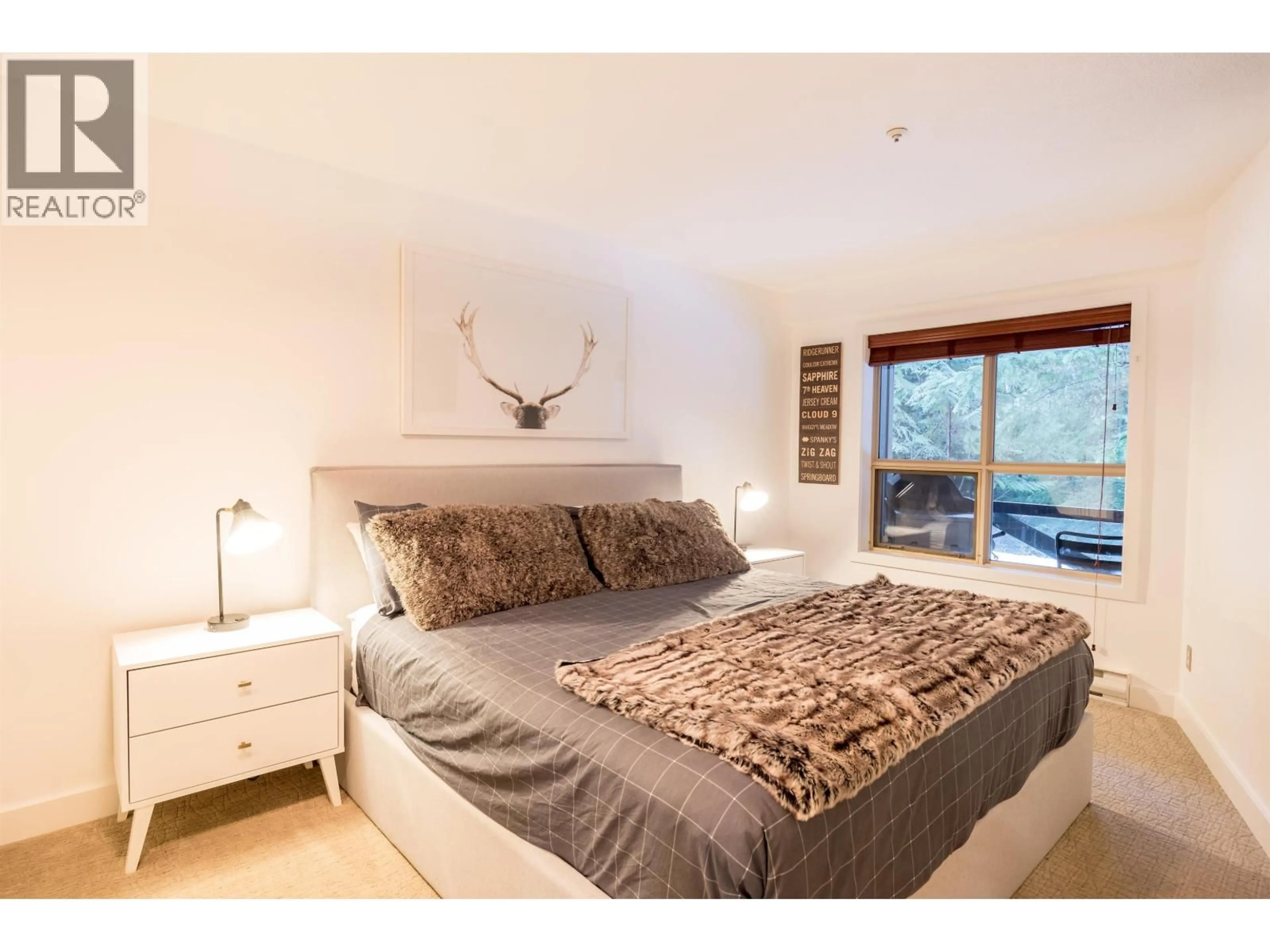 Bedroom with bed, wood/laminate floor for 116 - 4800 SPEARHEAD DRIVE, Whistler British Columbia V8E1G1