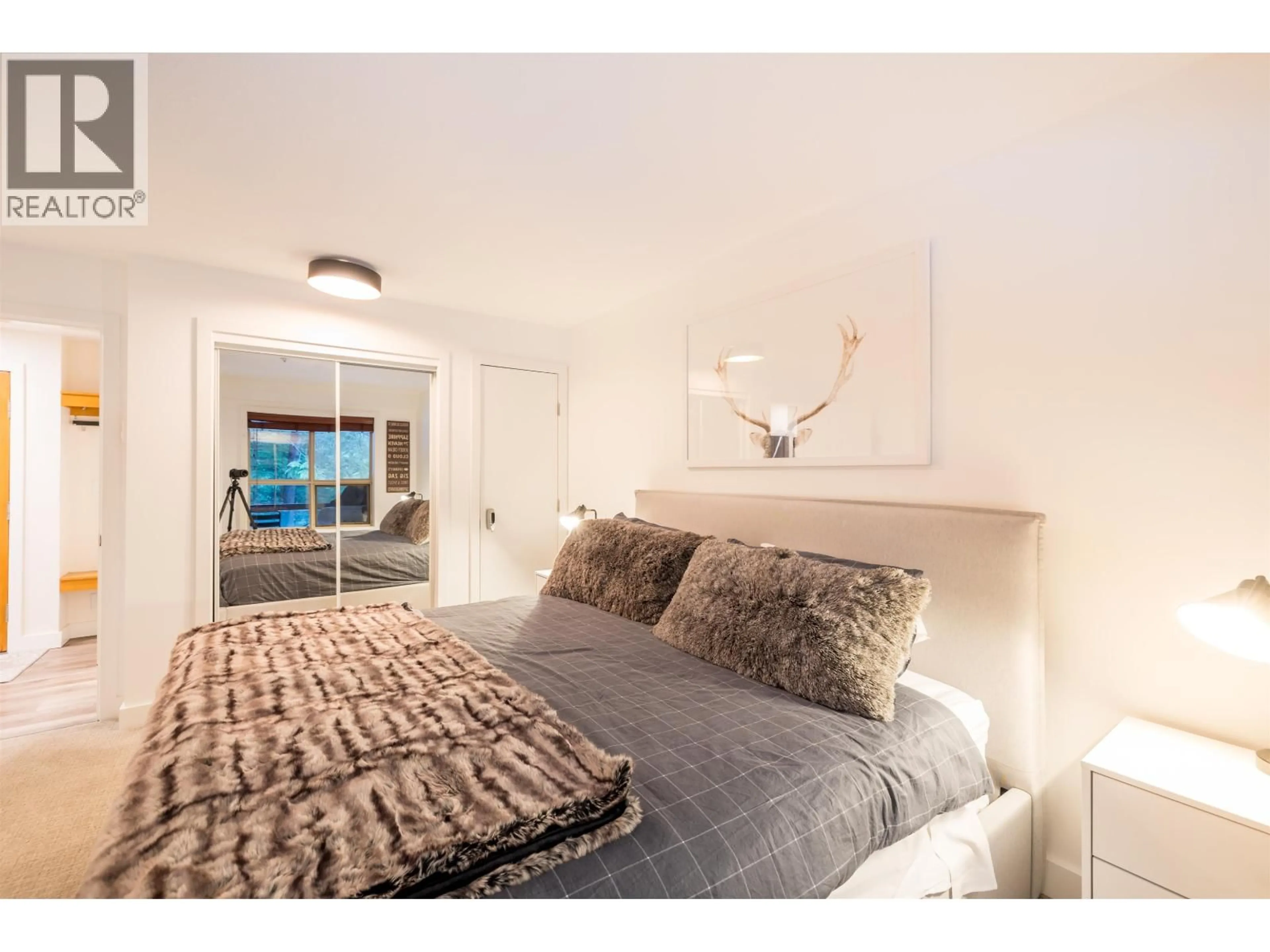 Bedroom with bed, wood/laminate floor for 116 - 4800 SPEARHEAD DRIVE, Whistler British Columbia V8E1G1