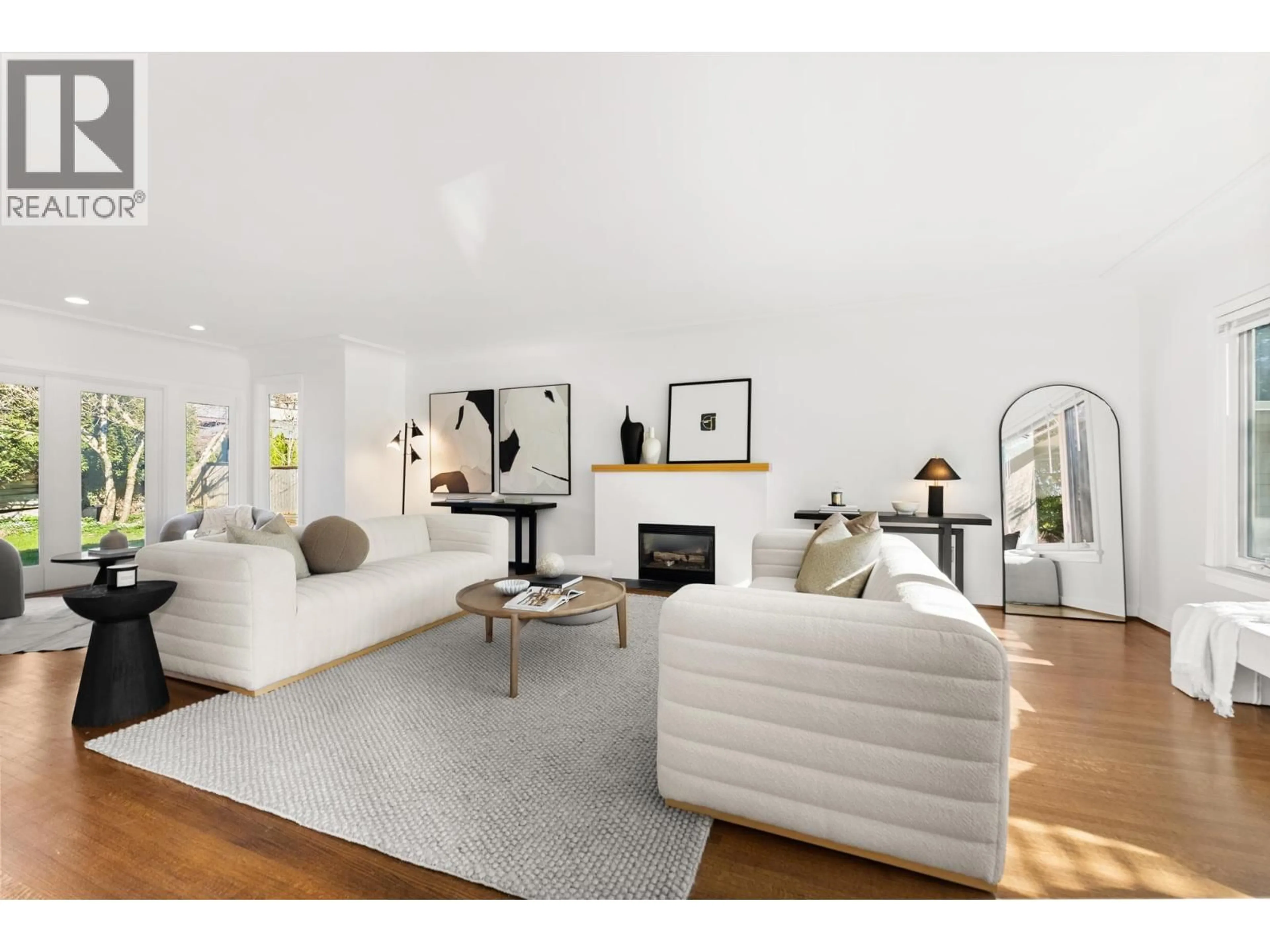 Living room with furniture, wood/laminate floor for 4709 CHANCELLOR BOULEVARD, Vancouver British Columbia V6T1C8