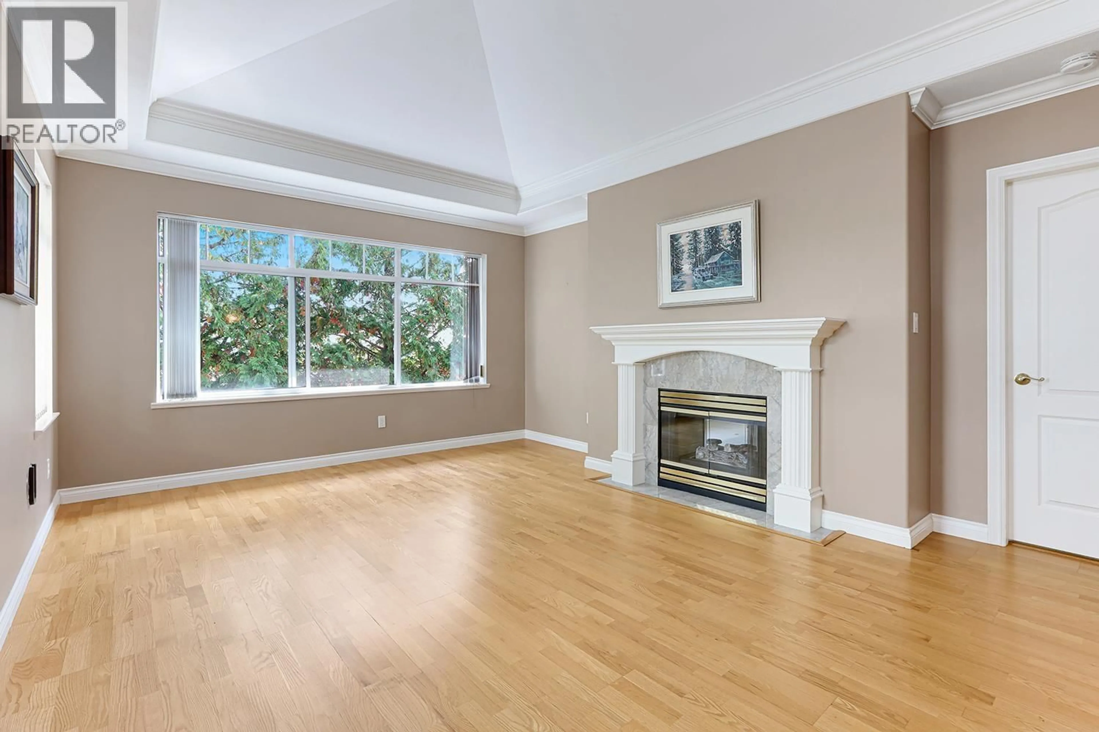 Living room with furniture, wood/laminate floor for 303 - 1280 55 STREET, Delta British Columbia V4M3K3