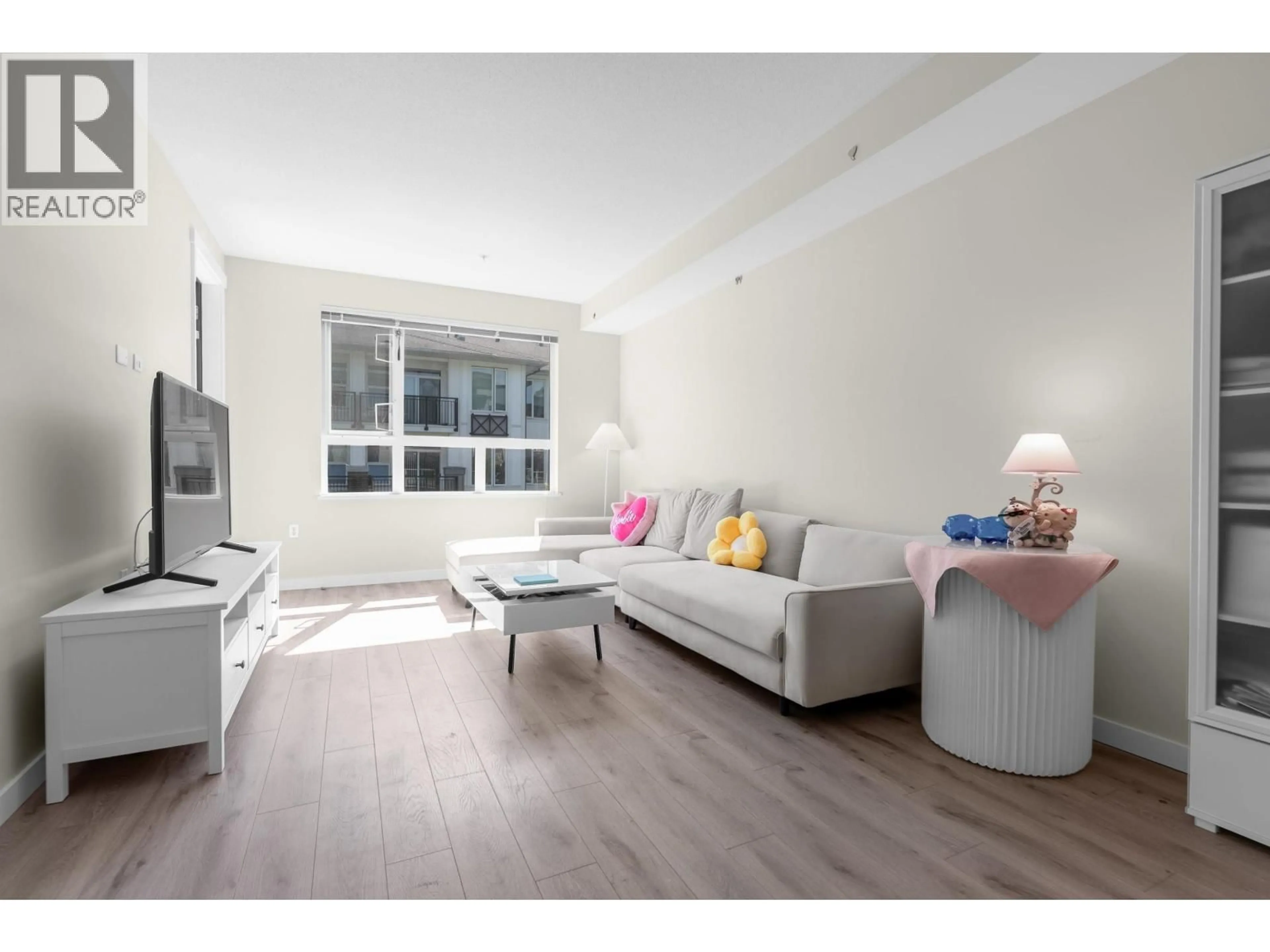 Living room with furniture, wood/laminate floor for 315 - 9233 ODLIN ROAD, Richmond British Columbia V6X0V4