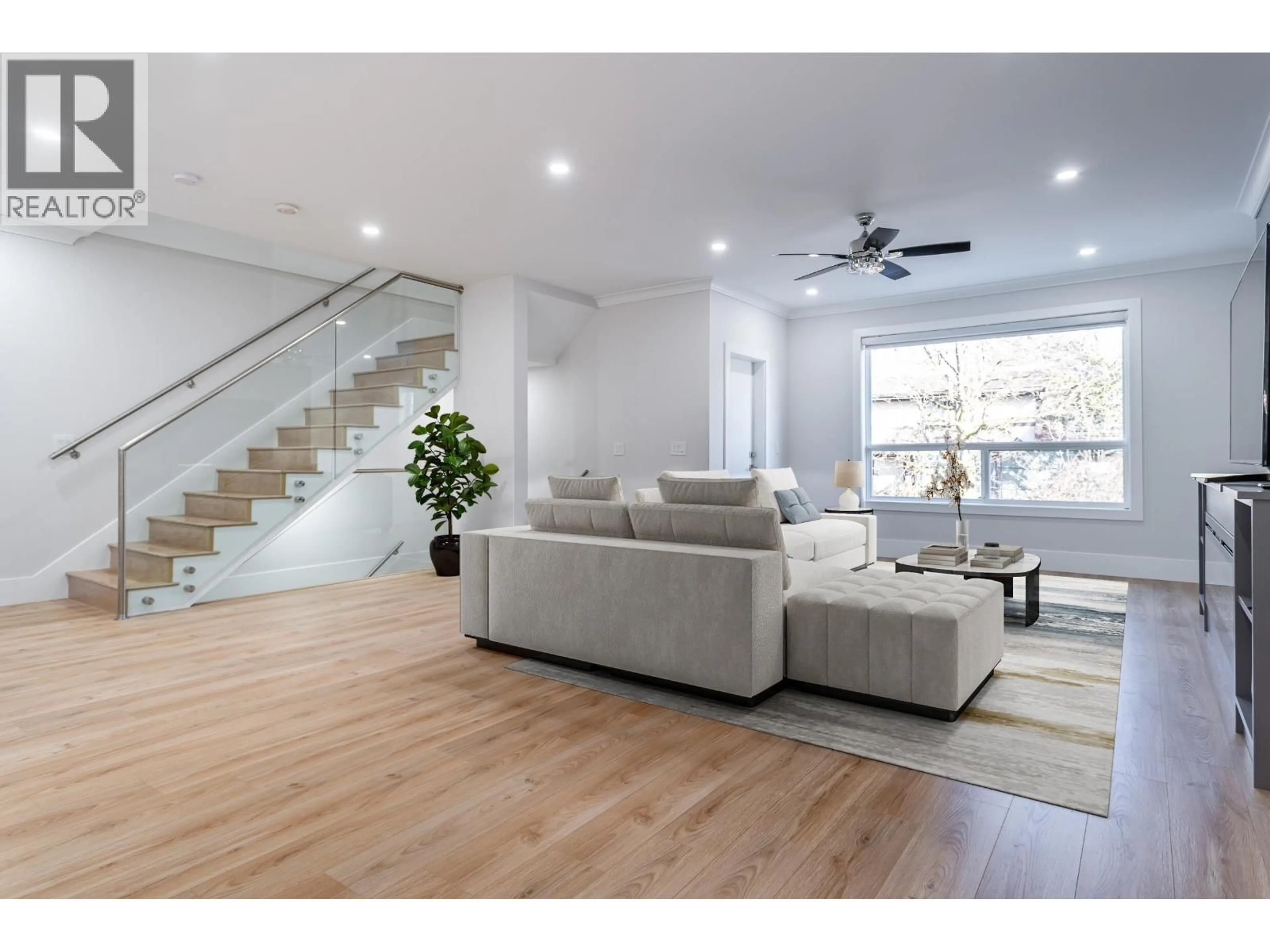 Living room with furniture, wood/laminate floor for 3409 VICTORIA DRIVE, Coquitlam British Columbia V3B2V5