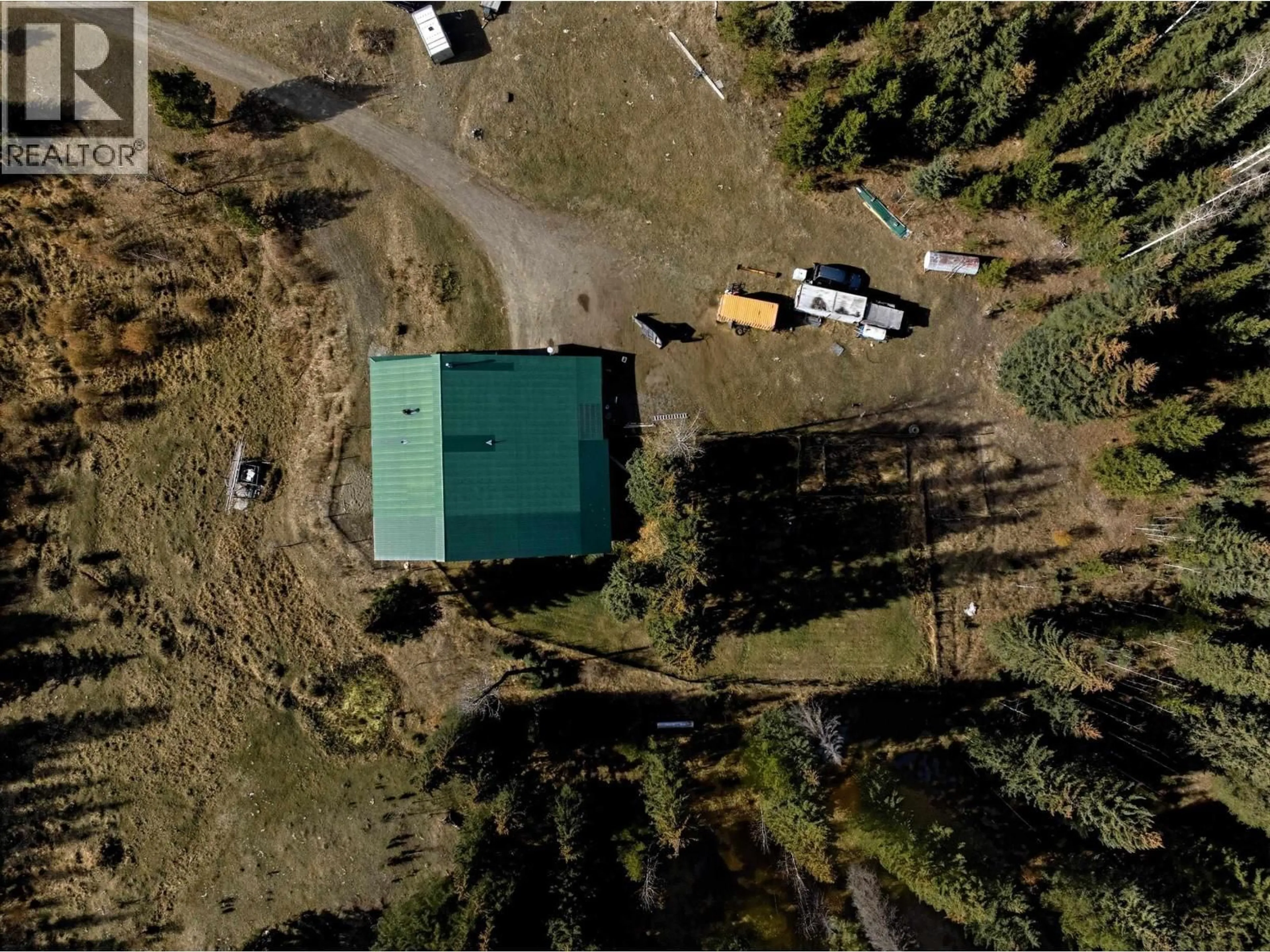A pic from outside/outdoor area/front of a property/back of a property/a pic from drone, unknown for 6391 HOUSEMAN ROAD, 100 Mile House British Columbia V0K1G0