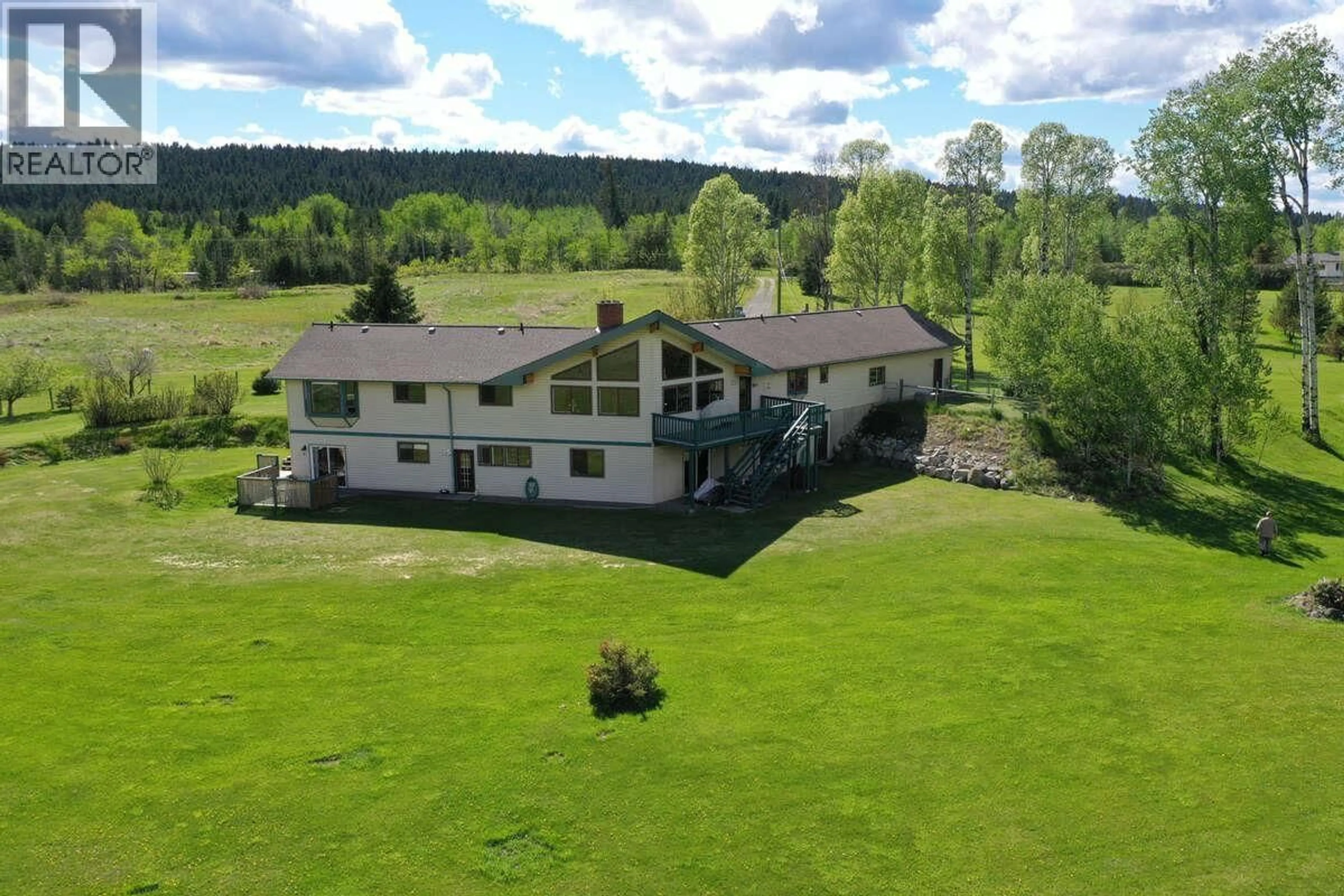 A pic from outside/outdoor area/front of a property/back of a property/a pic from drone, unknown for 4221 LODGE ROAD, Lac La Hache British Columbia V0K1T0
