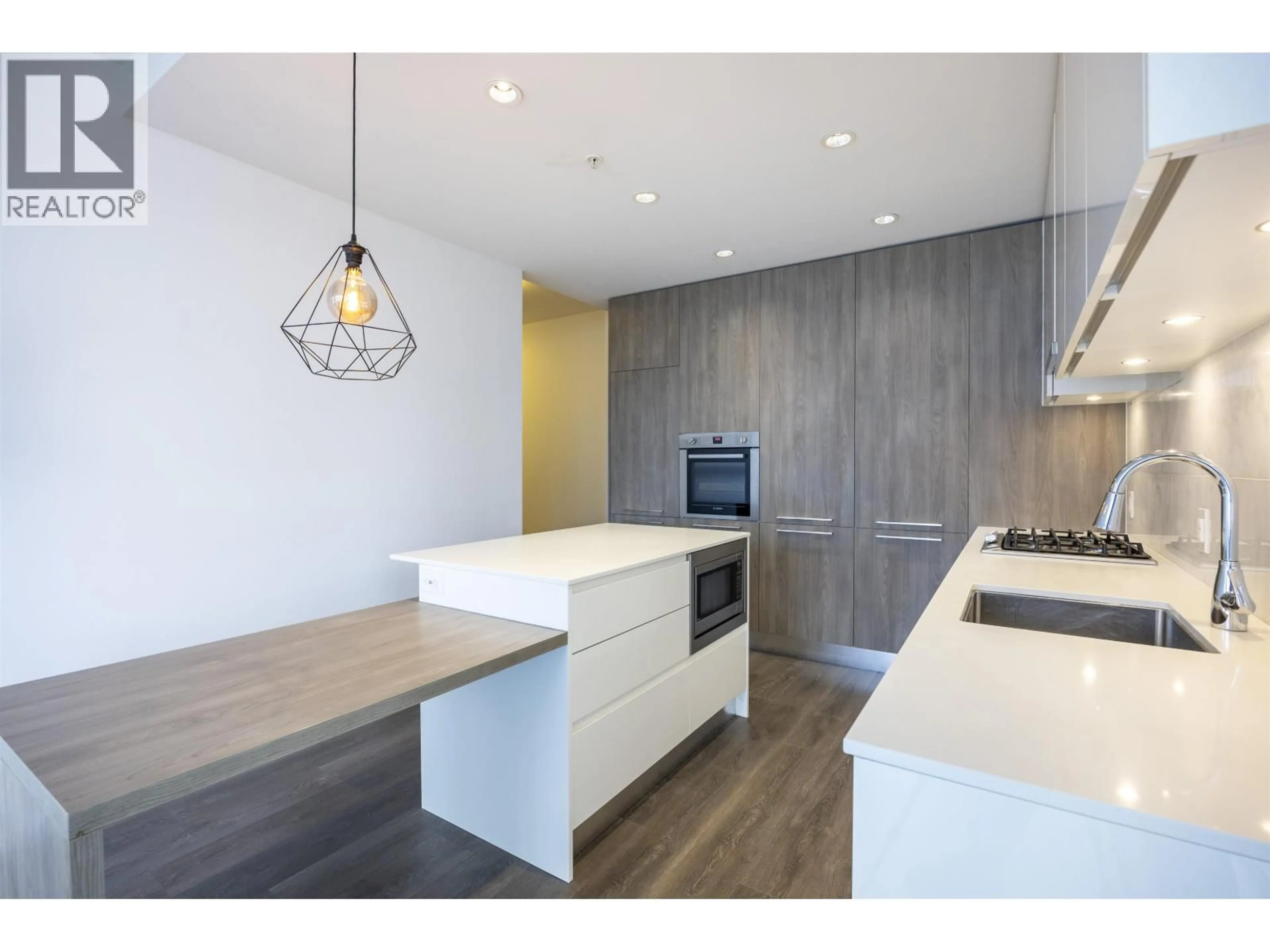 Open concept kitchen, wood/laminate floor for 809 - 1955 ALPHA WAY, Burnaby British Columbia V5C0K9