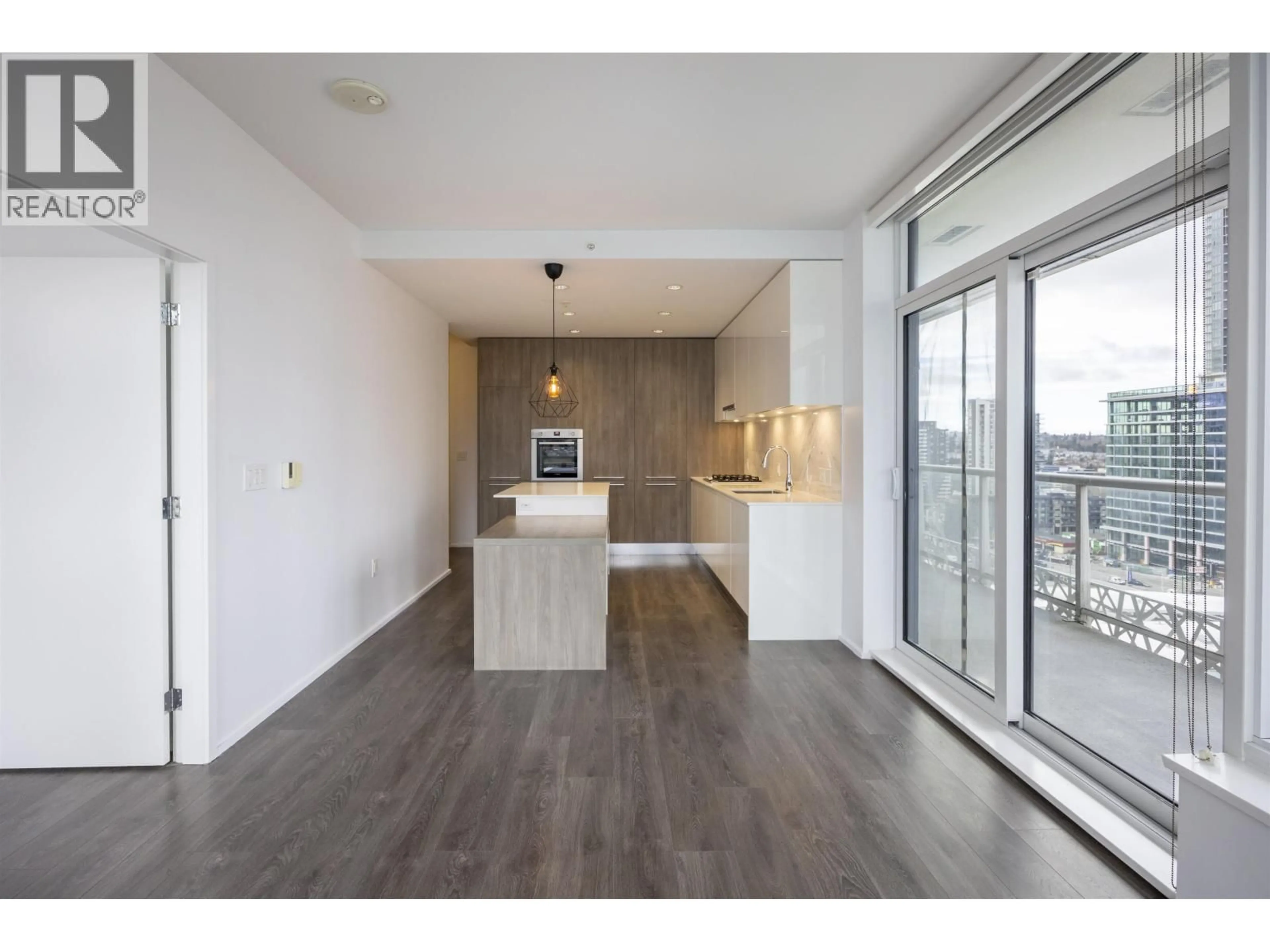 Open concept kitchen, wood/laminate floor for 809 - 1955 ALPHA WAY, Burnaby British Columbia V5C0K9