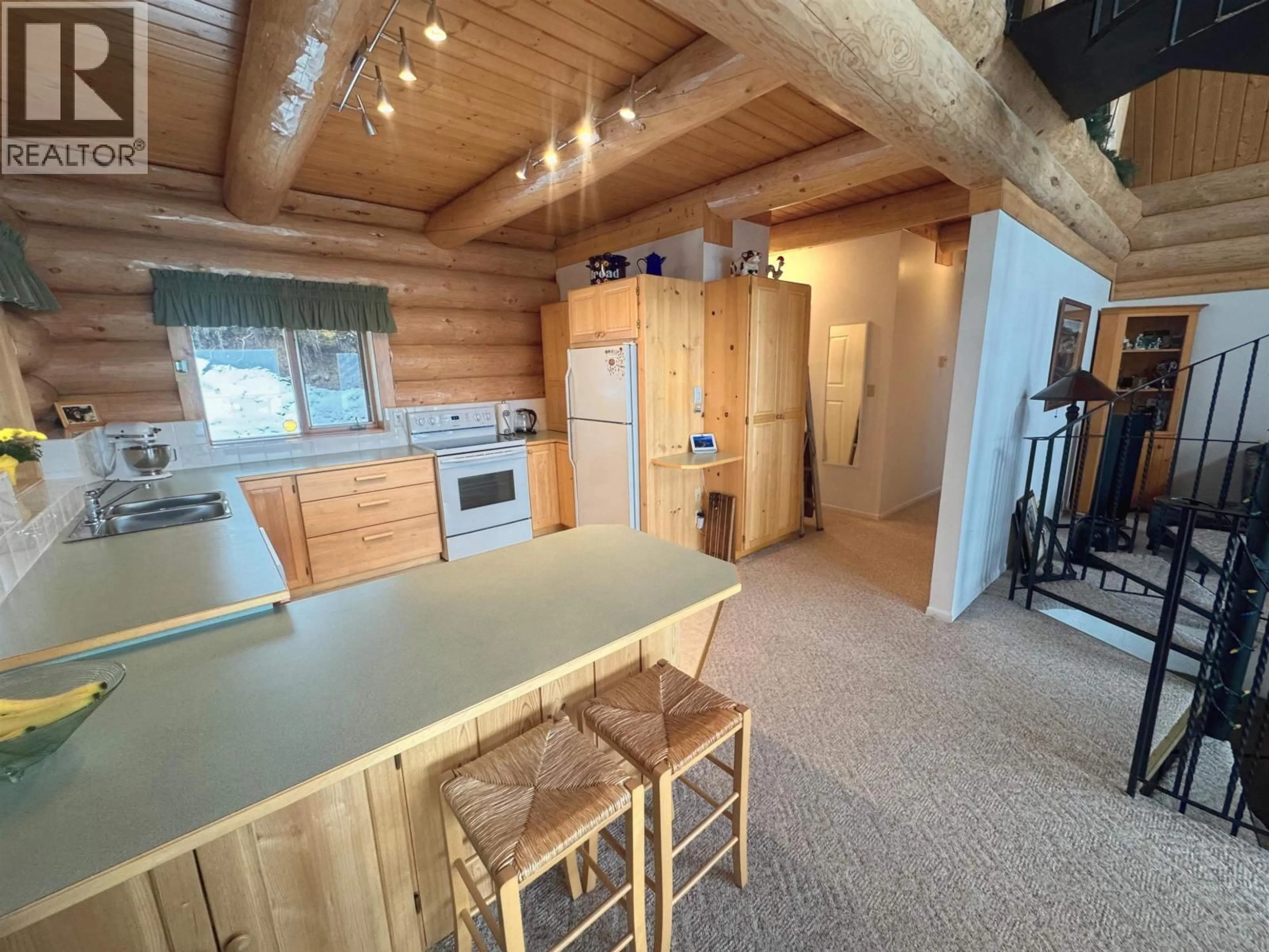 Open concept kitchen, wood/laminate floor for 5278 KALLUM DRIVE, 108 Mile Ranch British Columbia V0K2Z0