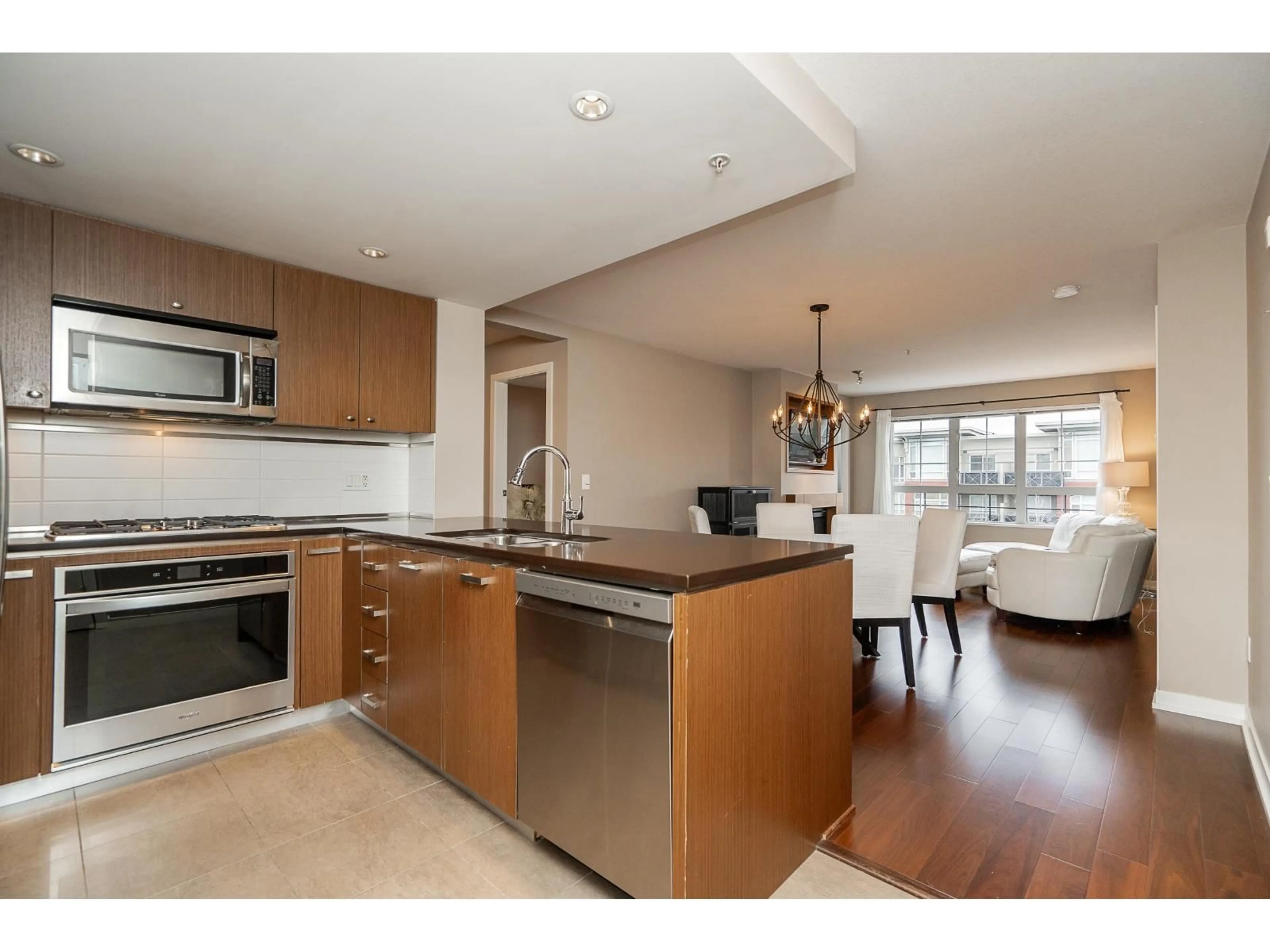 Open concept kitchen, unknown for 303 - 2950 KING GEORGE BOULEVARD, Surrey British Columbia V4P0E5