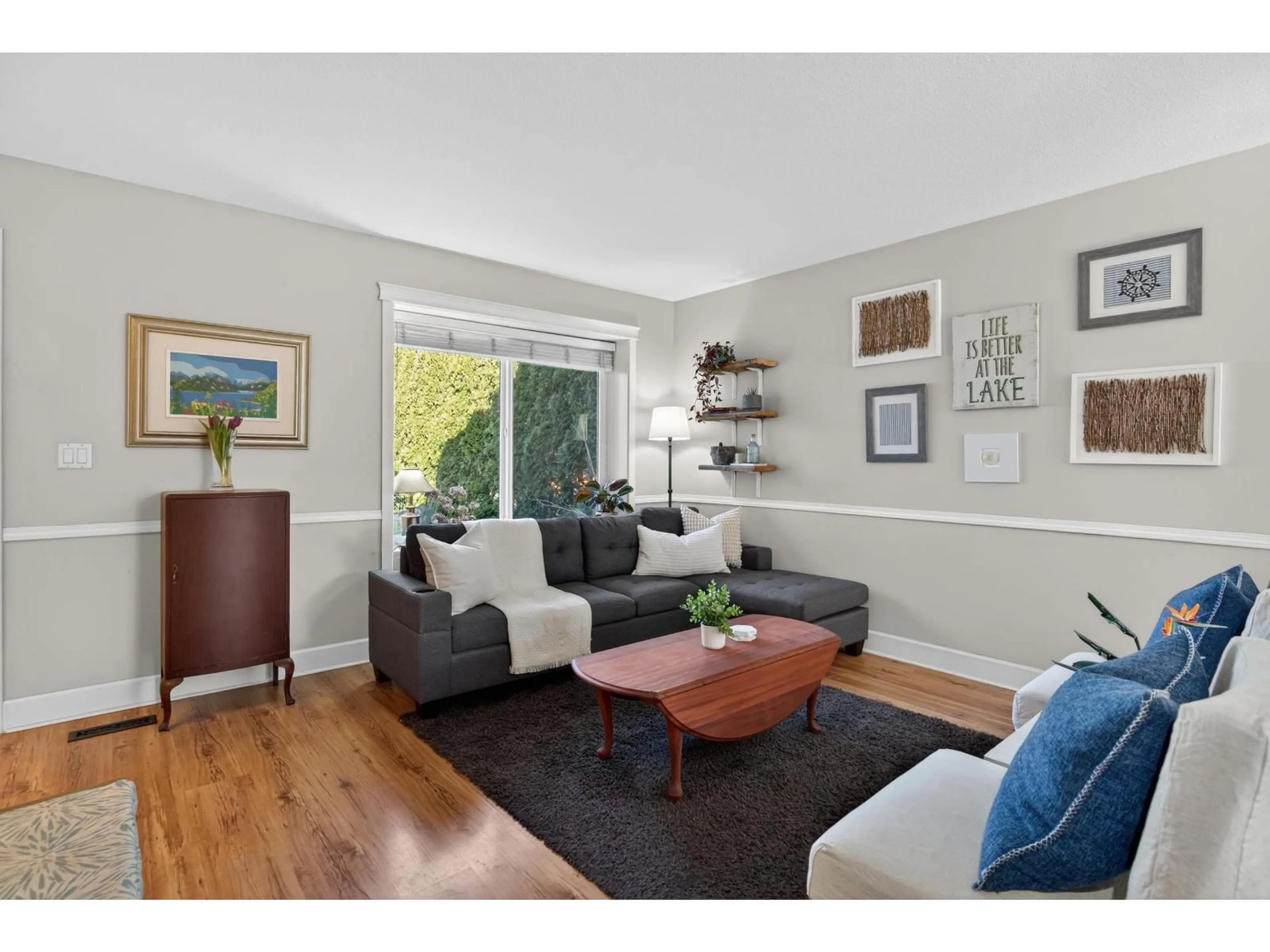 Living room with furniture, wood/laminate floor for 19804 68 AVENUE, Langley British Columbia V2Y1H6