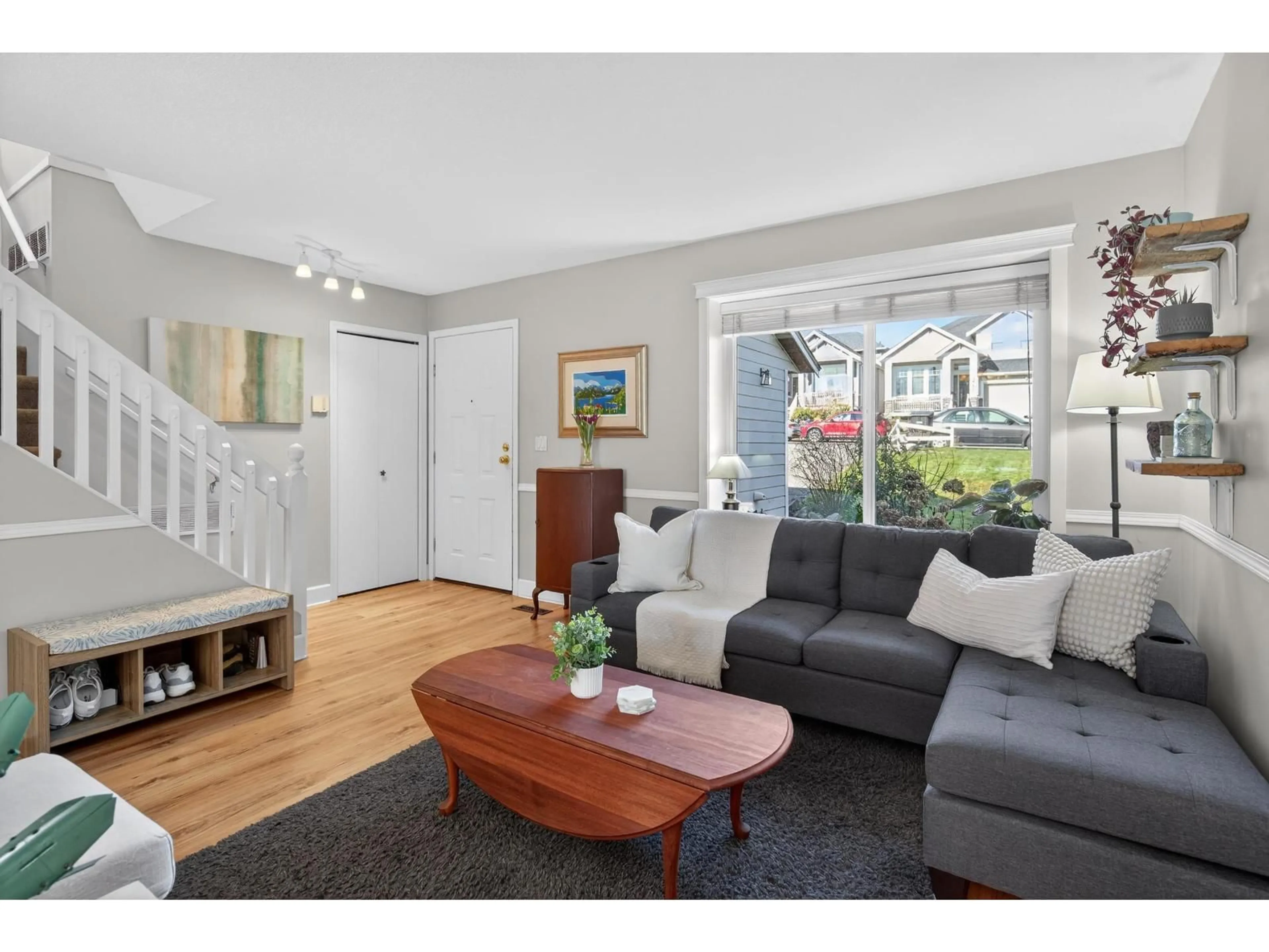 Living room with furniture, wood/laminate floor for 19804 68 AVENUE, Langley British Columbia V2Y1H6