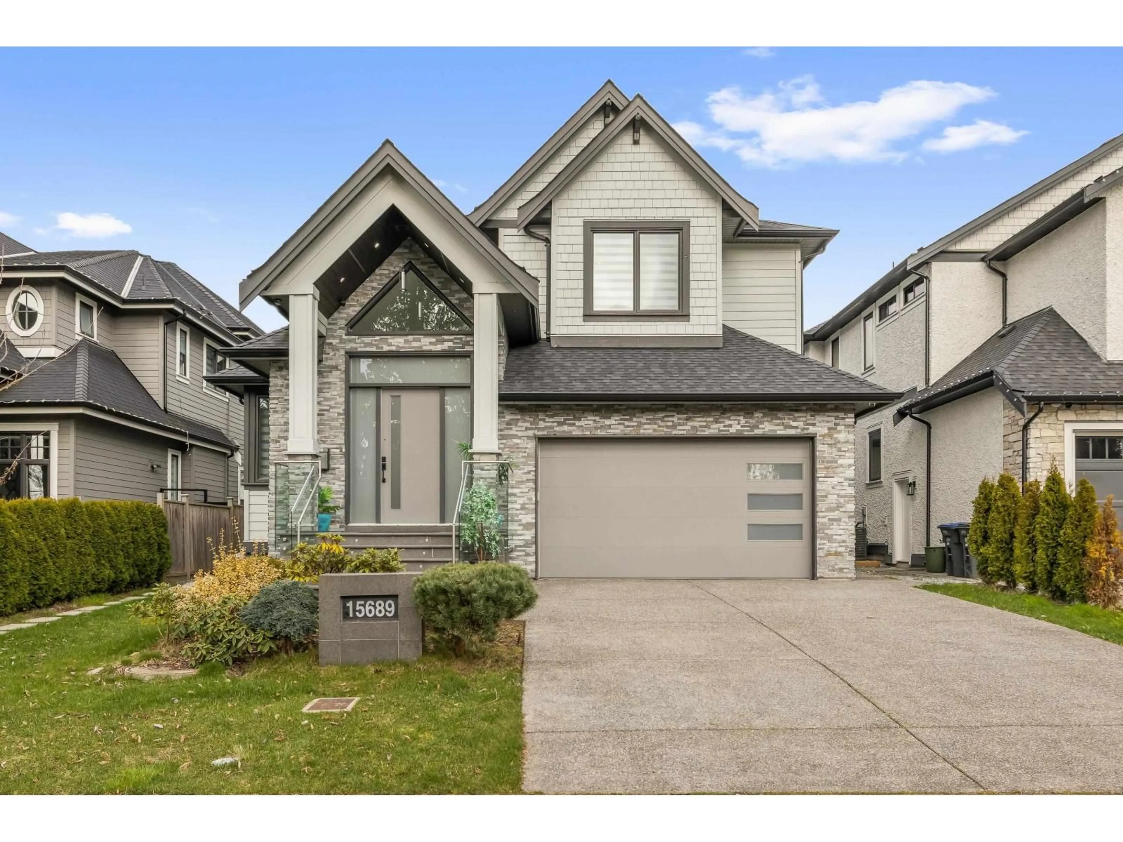 Home with vinyl exterior material, street for 15689 106A AVENUE, Surrey British Columbia V4N1K3