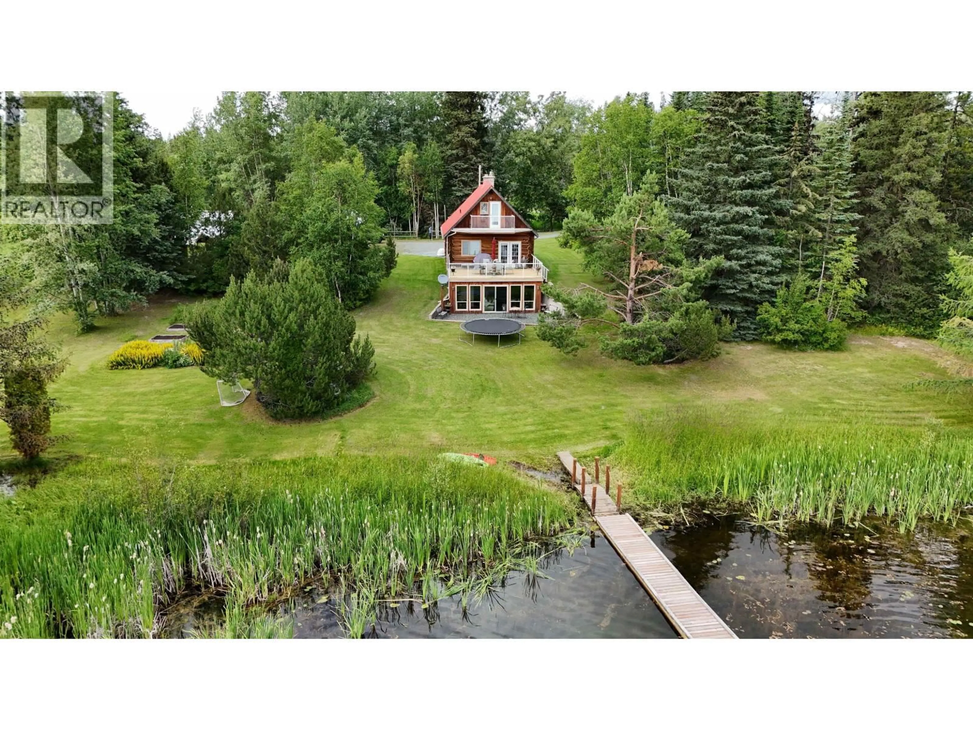 A pic from outside/outdoor area/front of a property/back of a property/a pic from drone, water/lake/river/ocean view for 24845 CHIEF LAKE ROAD, Prince George British Columbia V2K5L1
