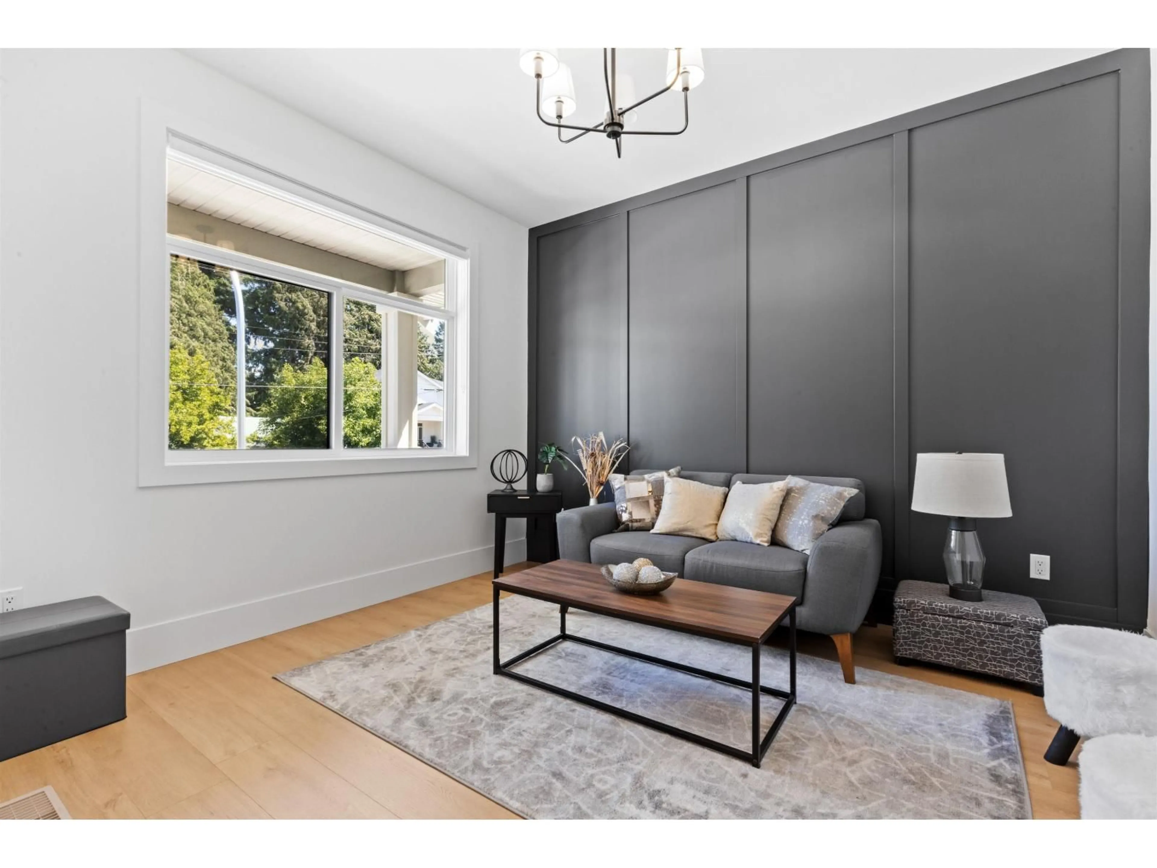 Living room with furniture, wood/laminate floor for 7143 ELWOOD DRIVE, Chilliwack British Columbia V2R1G8