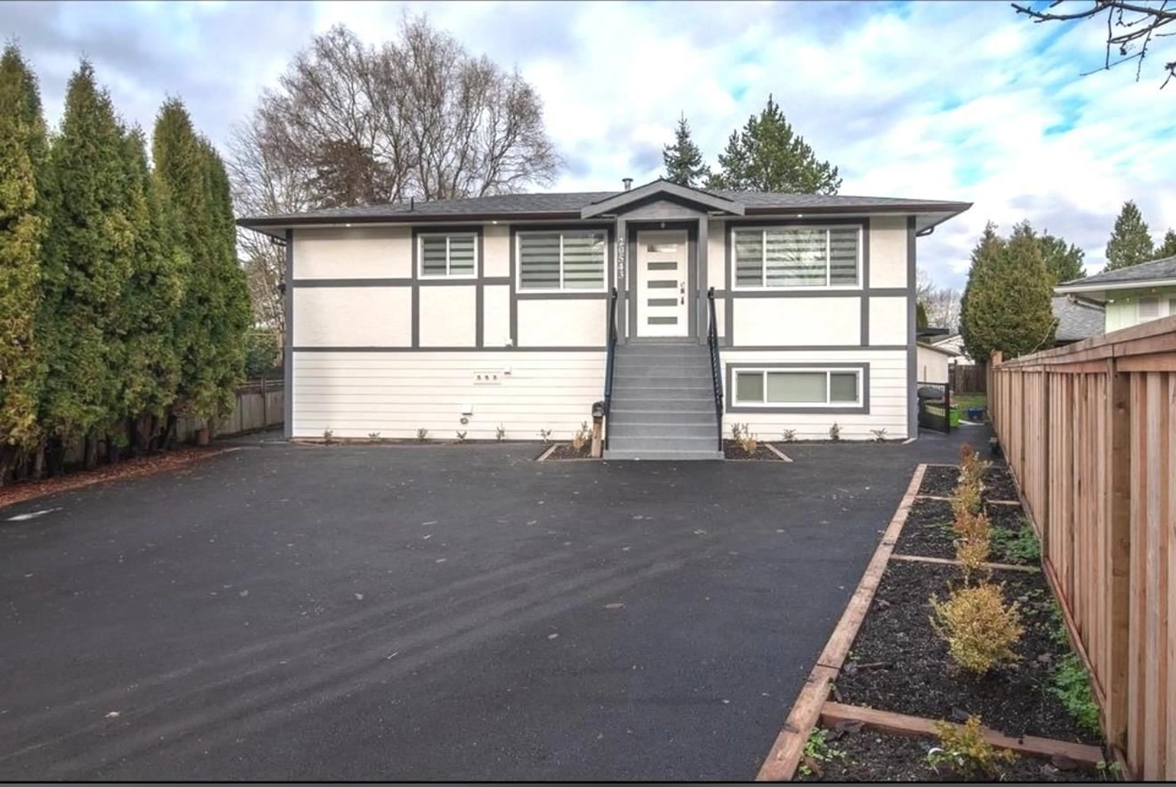 Home with vinyl exterior material, street for 20543 50A AVENUE, Langley British Columbia V3A6X3