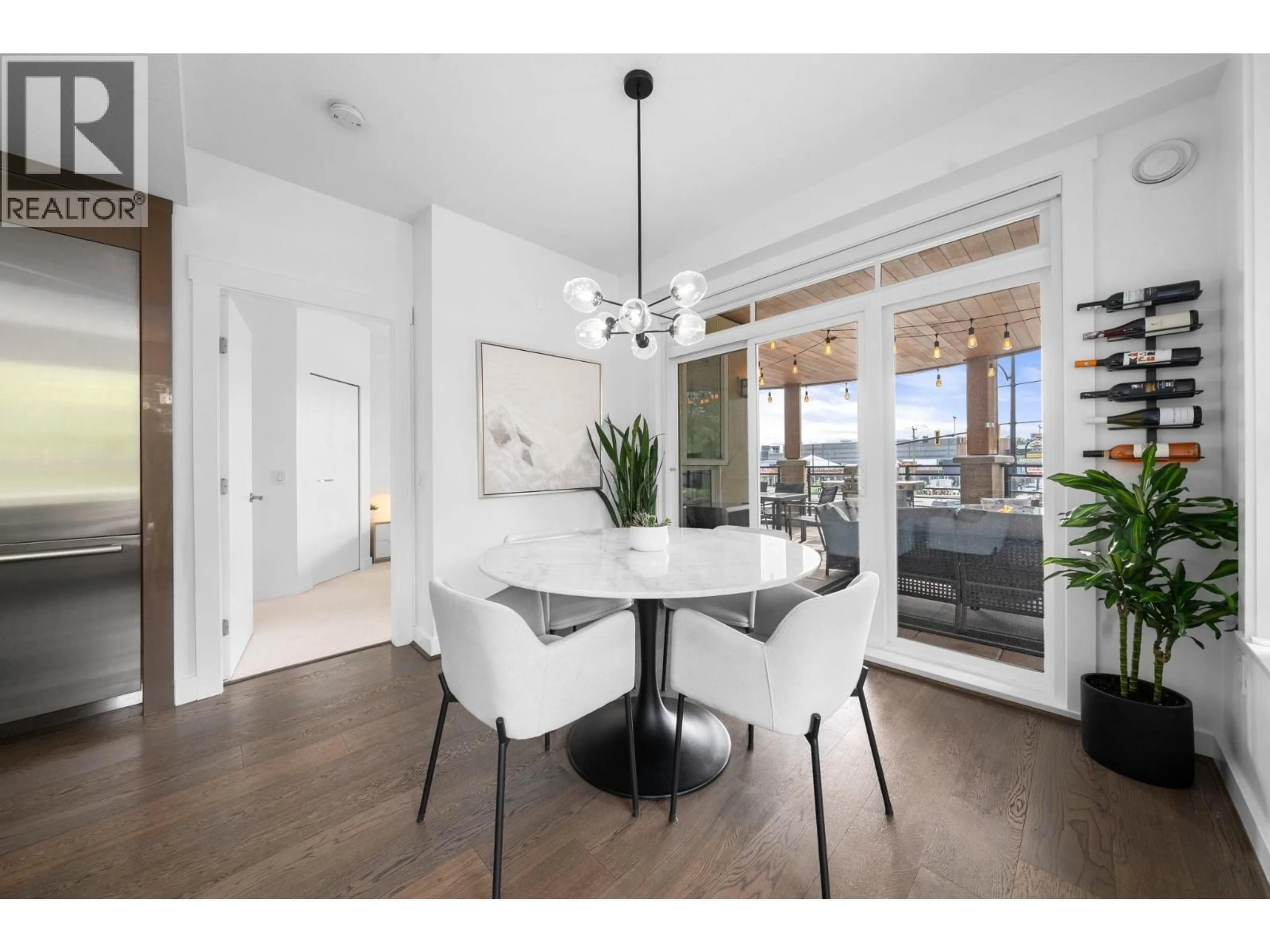 Dining room, wood/laminate floor for 218 - 733 14TH STREET, North Vancouver British Columbia V7M0C6