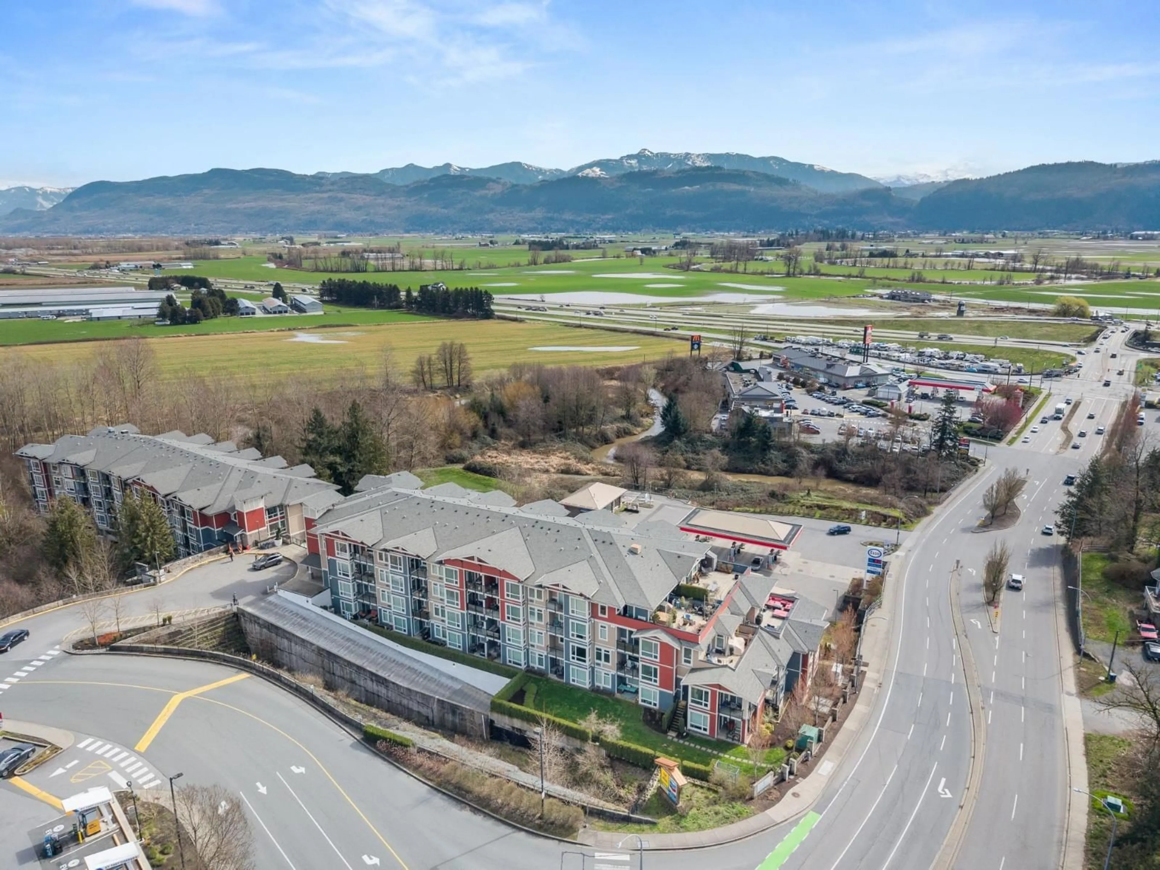 A pic from outside/outdoor area/front of a property/back of a property/a pic from drone, mountain view for 217 - 2242 WHATCOM ROAD, Abbotsford British Columbia V3G0G3