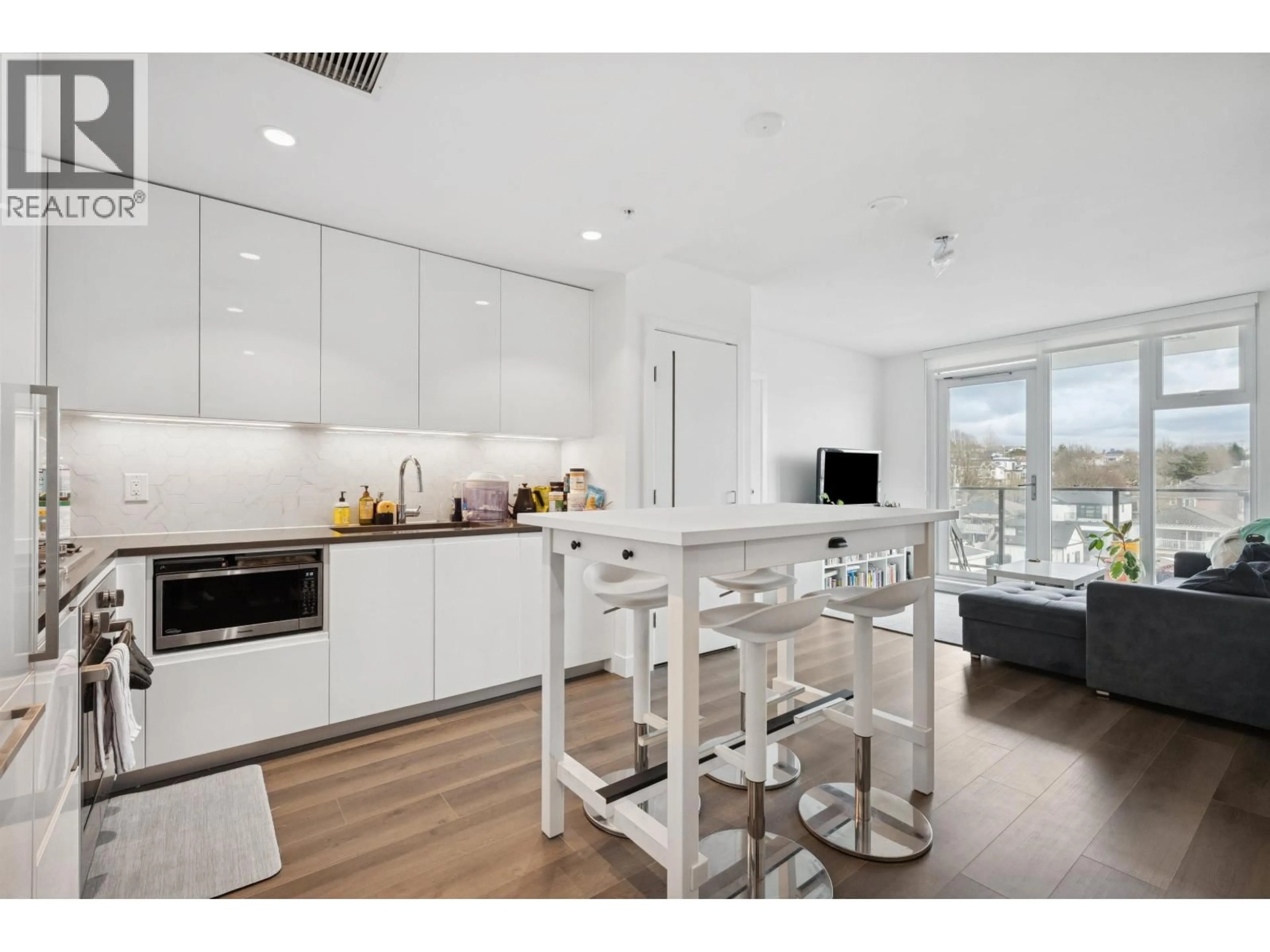 Open concept kitchen, wood/laminate floor for 506 - 8121 CHESTER STREET, Vancouver British Columbia V5X0J9