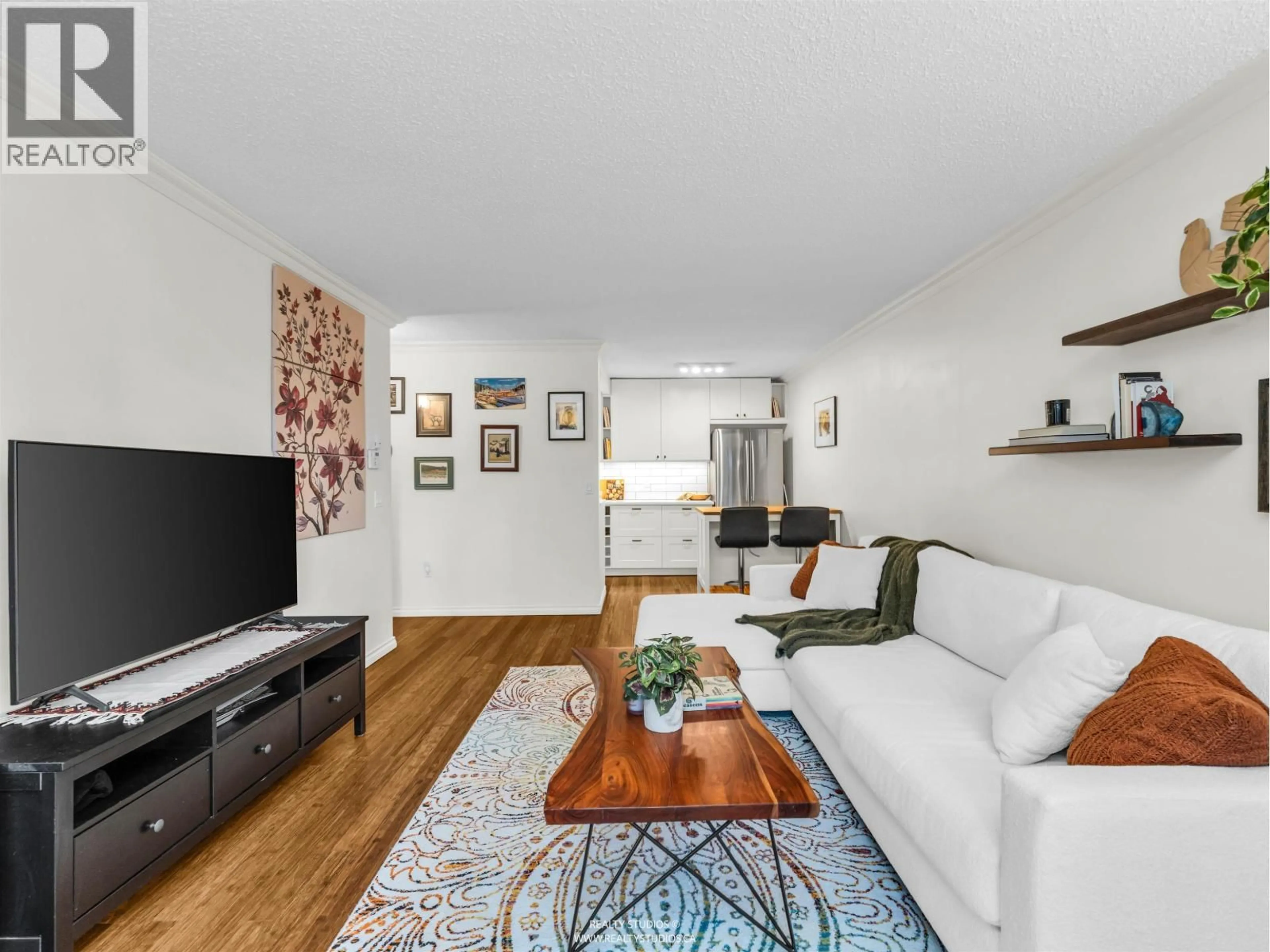 Living room with furniture, wood/laminate floor for 103 - 1412 14TH AVENUE, Vancouver British Columbia V6H1R3