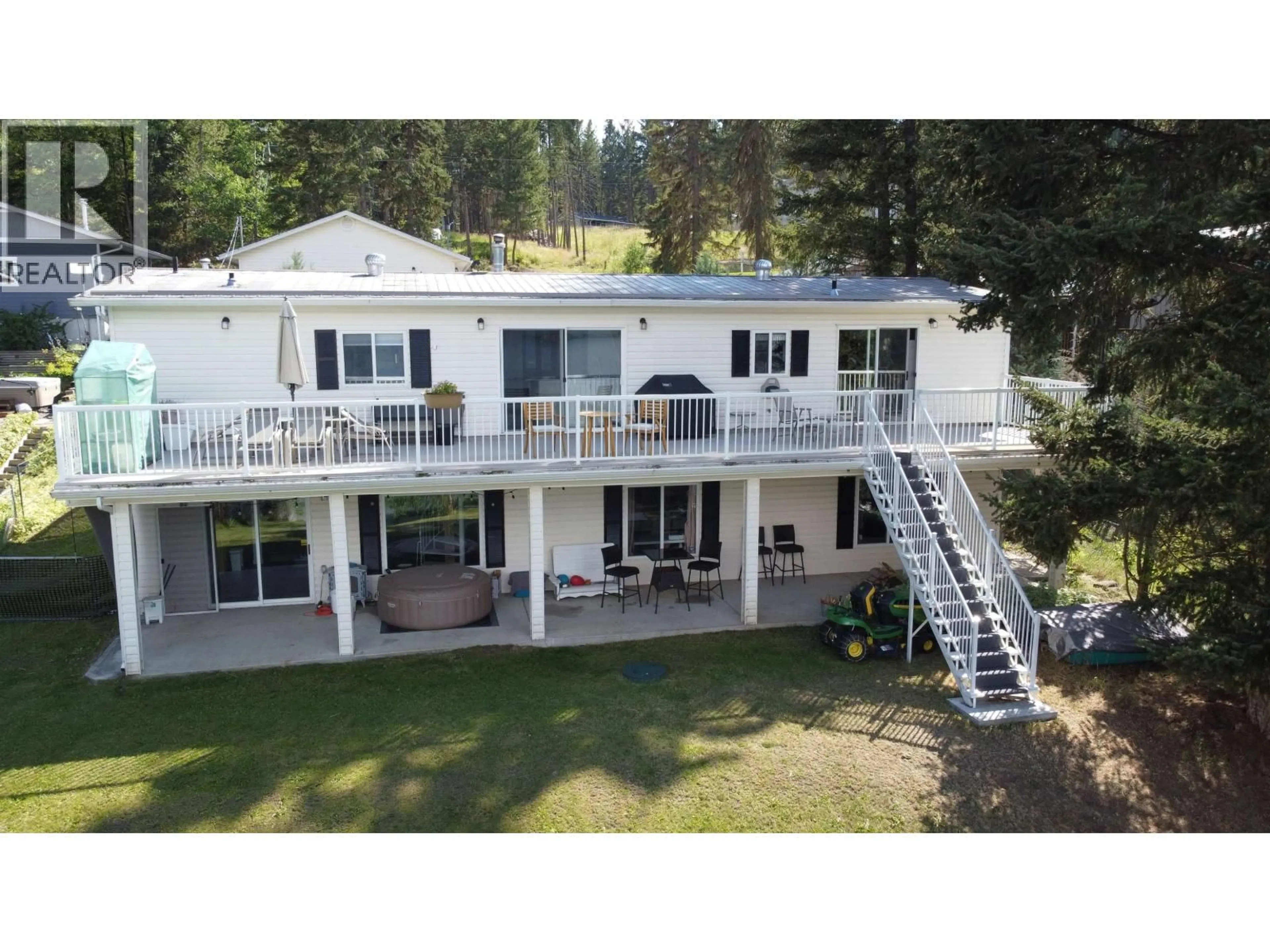 A pic from outside/outdoor area/front of a property/back of a property/a pic from drone, water/lake/river/ocean view for 6301 MULLIGAN ROAD, 100 Mile House British Columbia V0K2E3