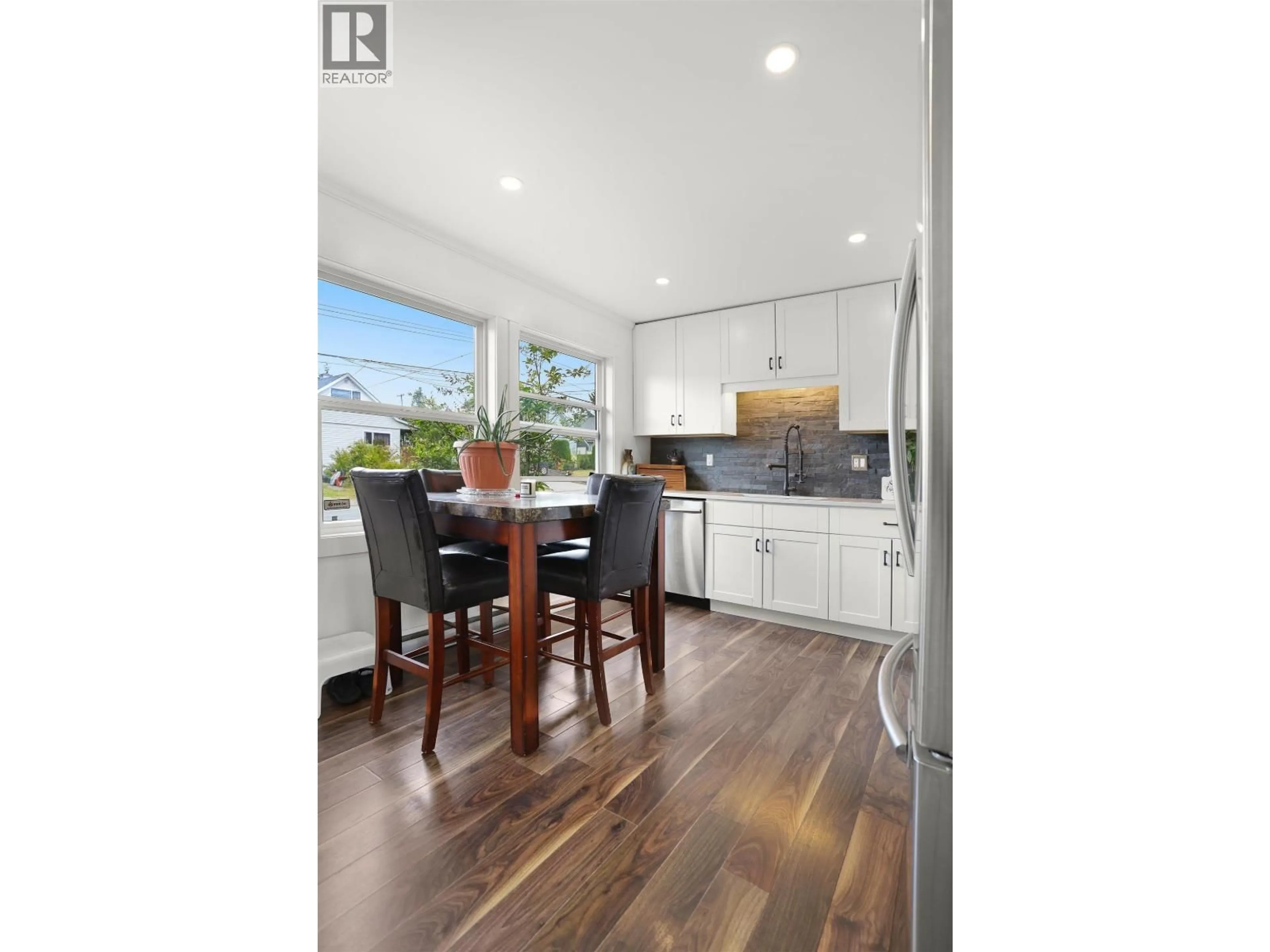 Open concept kitchen, wood/laminate floor for 48 FINCH STREET, Kitimat British Columbia V8C1T2