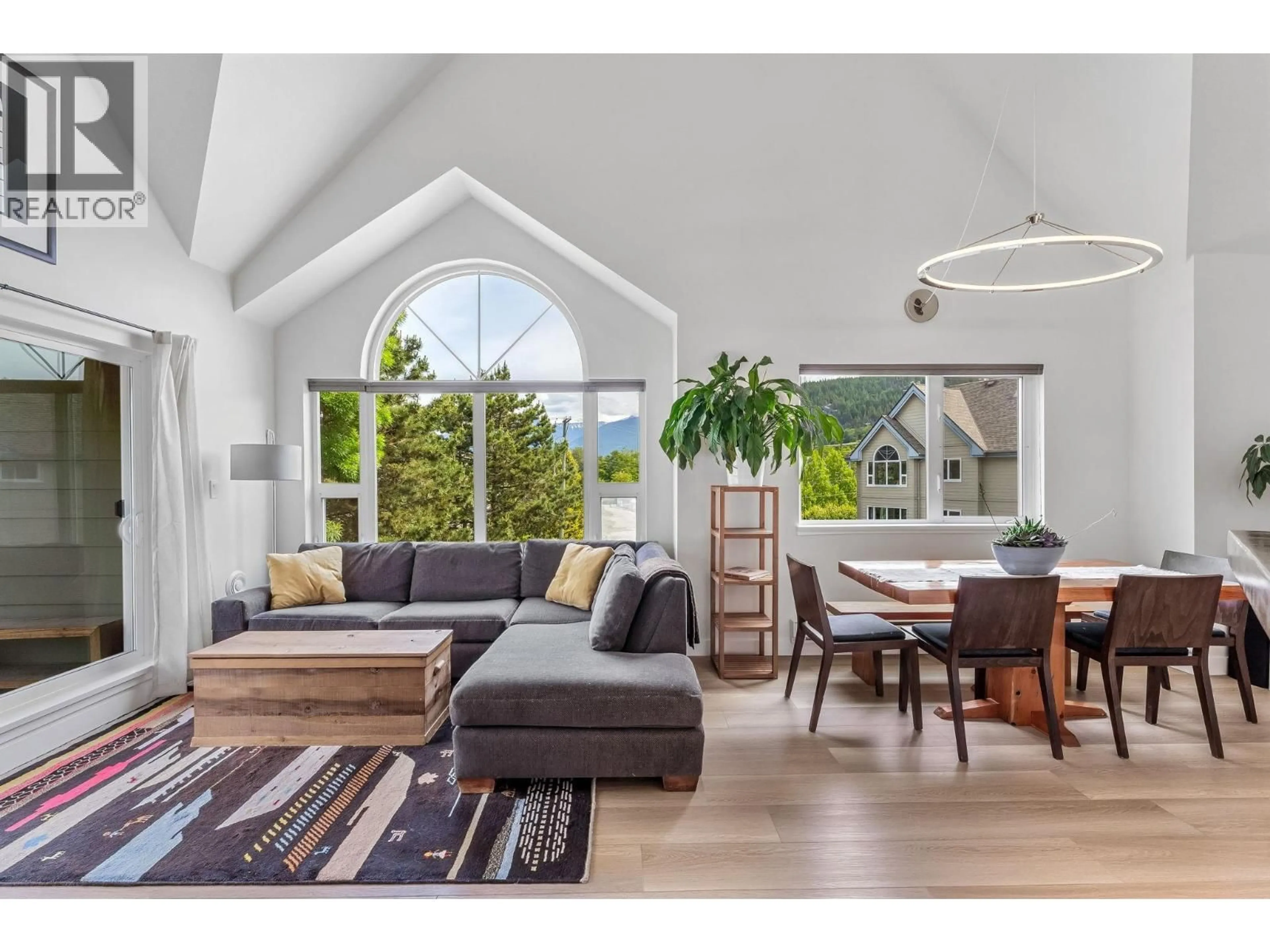 Living room with furniture, wood/laminate floor for 312 - 1466 PEMBERTON AVENUE, Squamish British Columbia V8B0K1